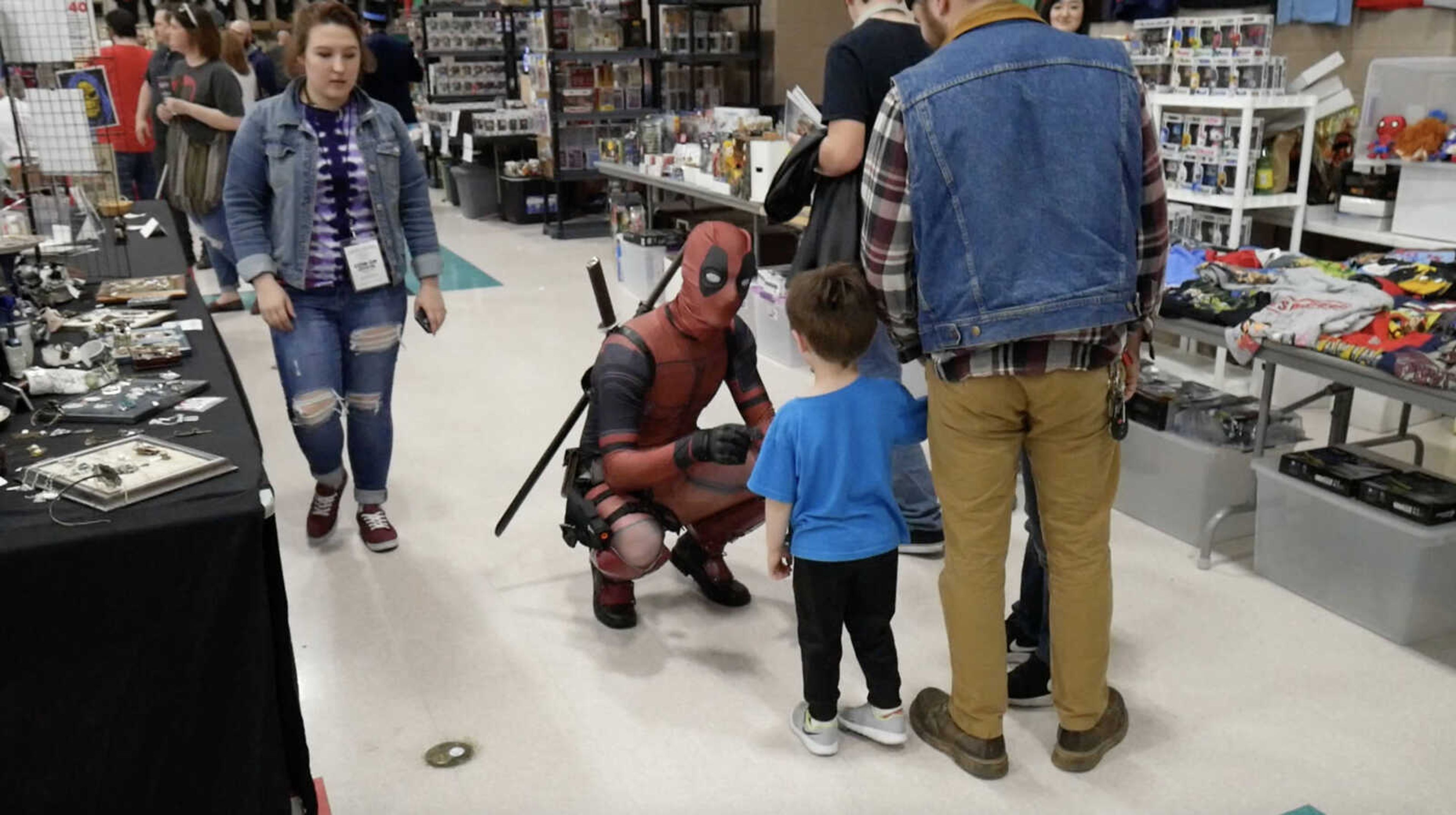 Deadpool speaks with a fan at the annual Cape Comic Con at the Osage Centre April 20.