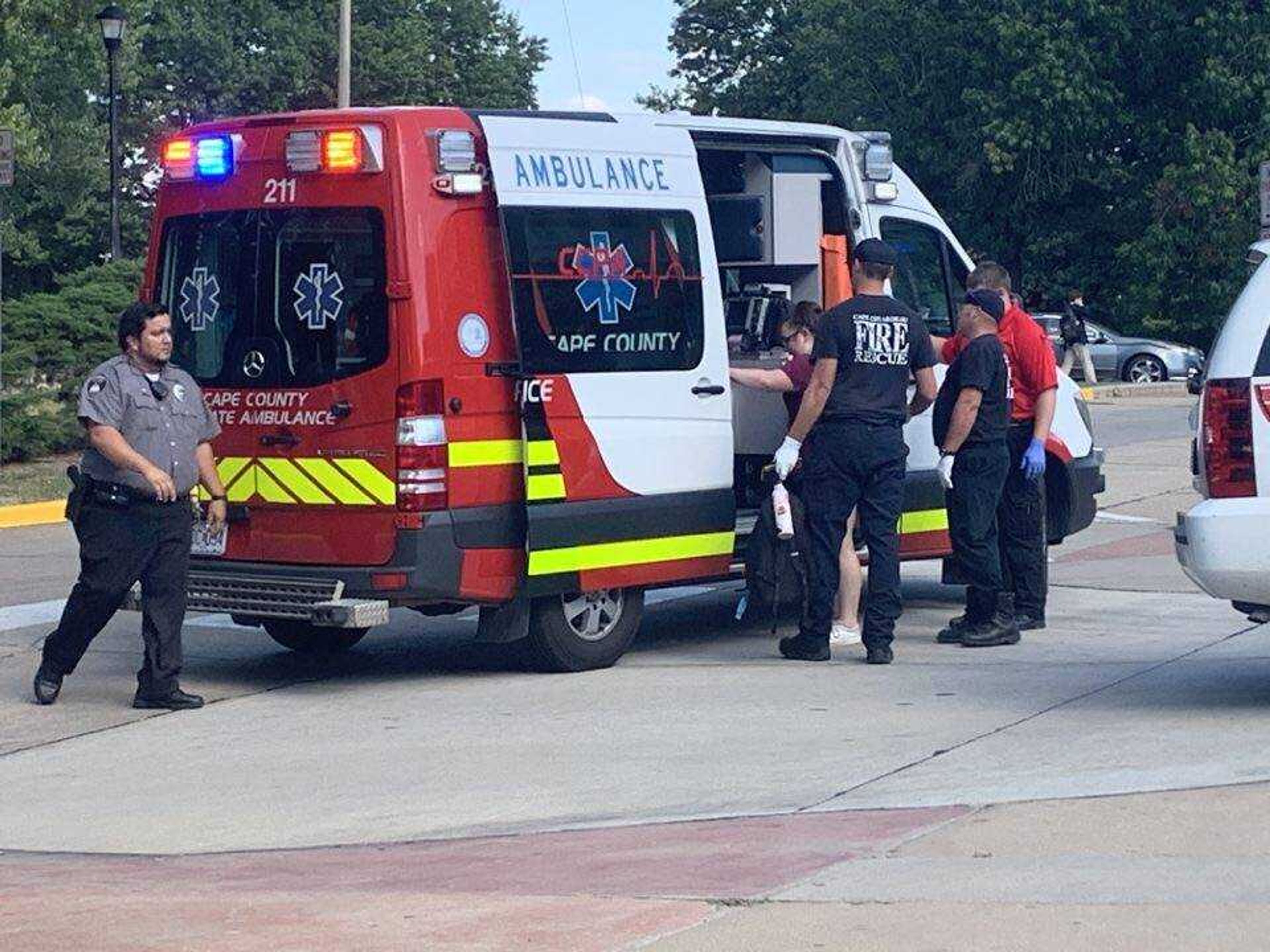 Cape Girardeau first responders assist a Southeast student into an ambulance after the student fell from a university shuttle Monday, Sept. 30.