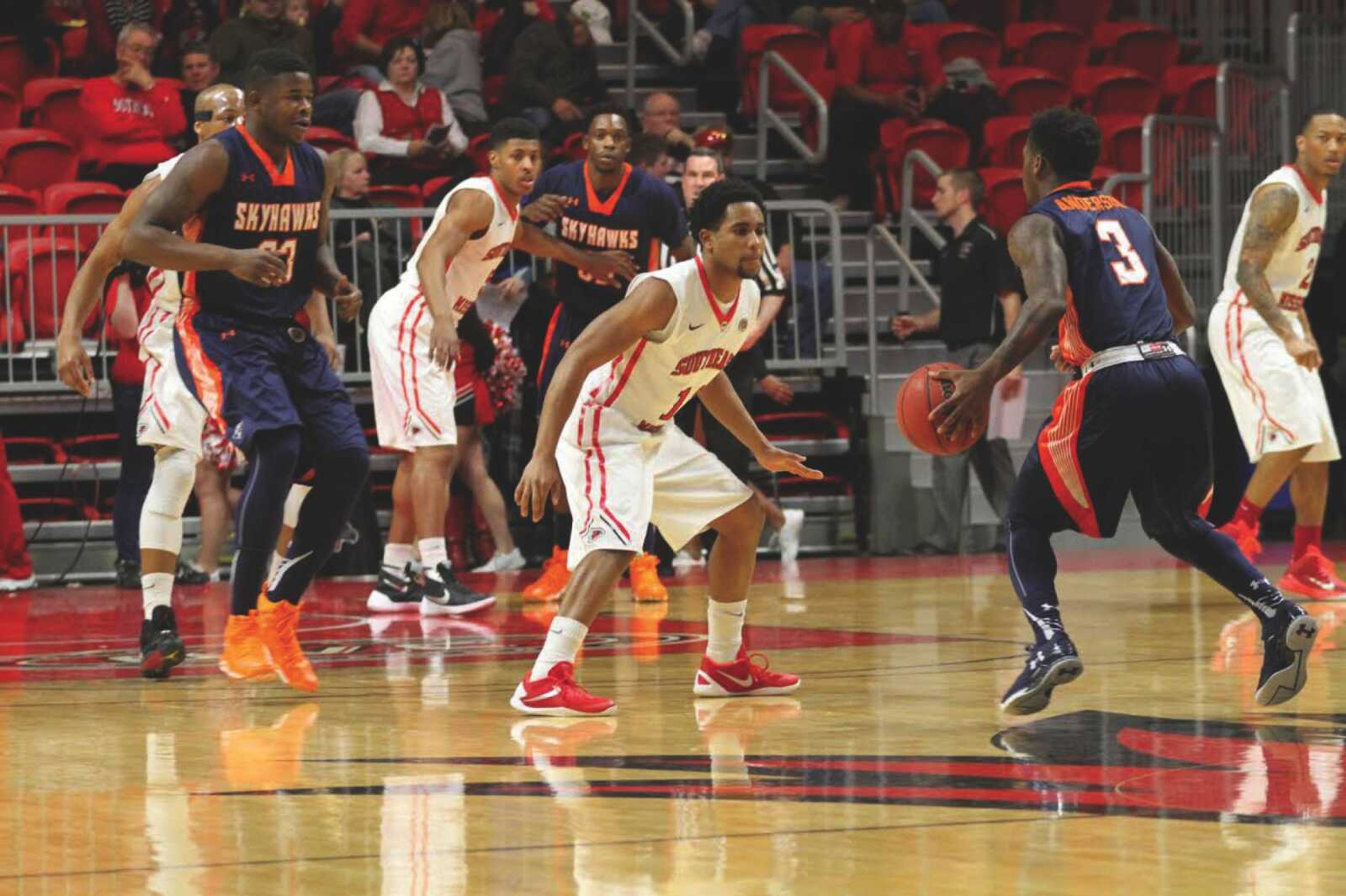 Junior guard Jamaal Calvin defends UT Martin guard Alex Anderson during Southeast's win on Sunday.