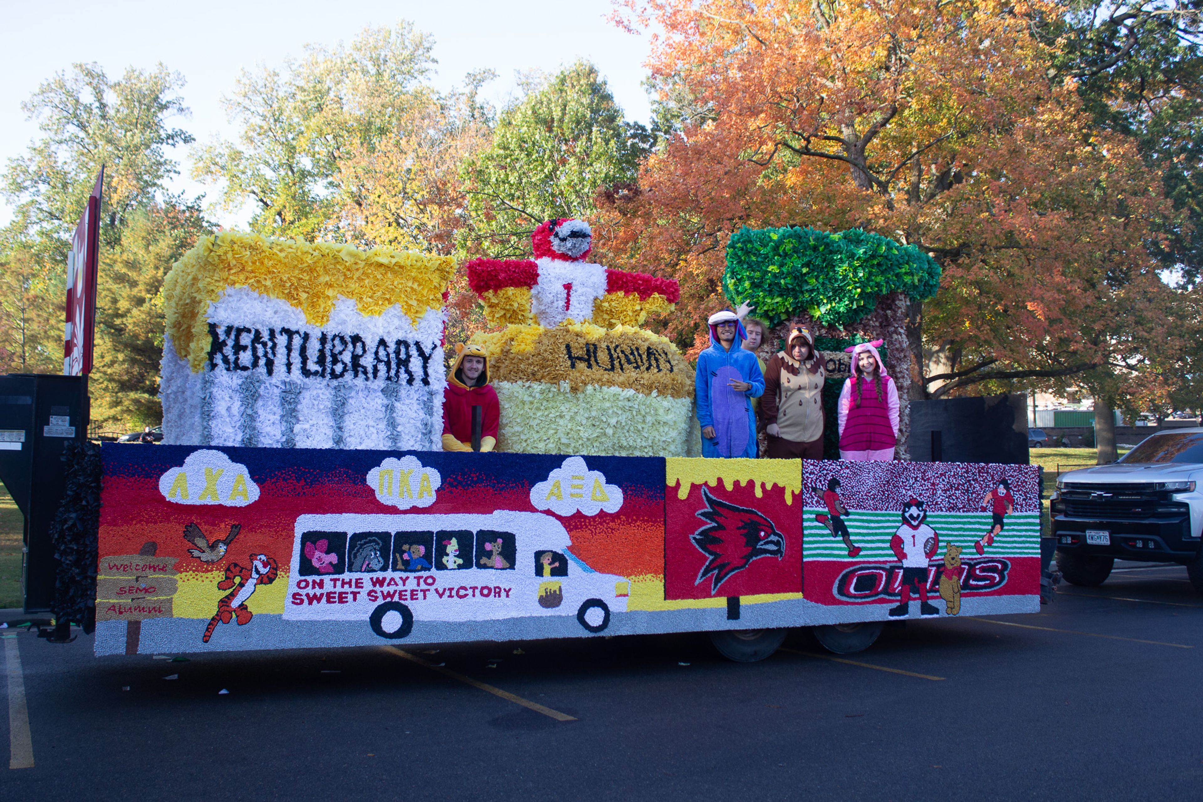 Alpha Xi Delta, Lambda Chi Alpha, and Pi Kappa Alpha wait for the parade to start.