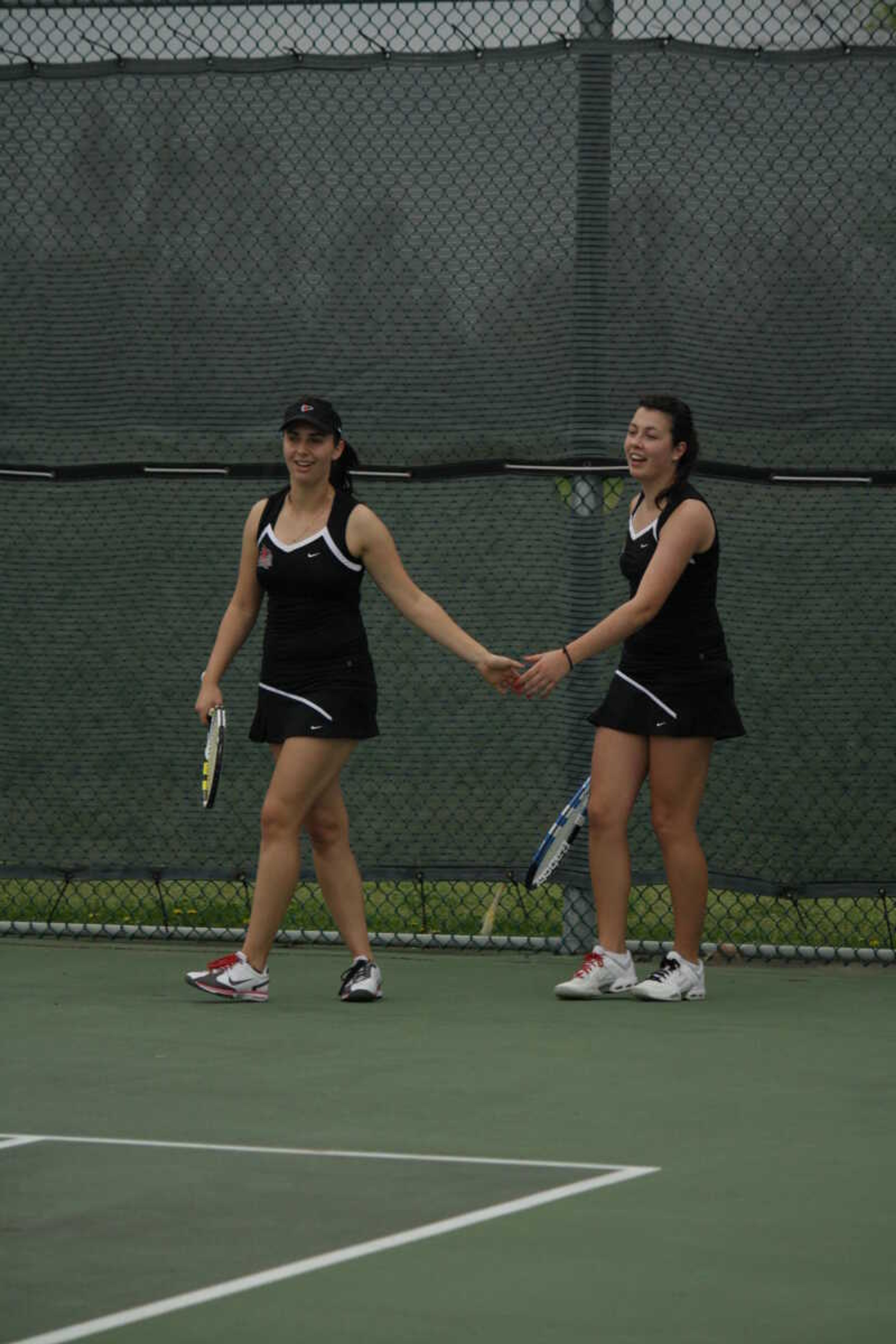 Melissa Martin (right) and teammate Nikole Novikova Sunday at the 
Southeast Tennis Complex. - Photo by Nathan Hamilton