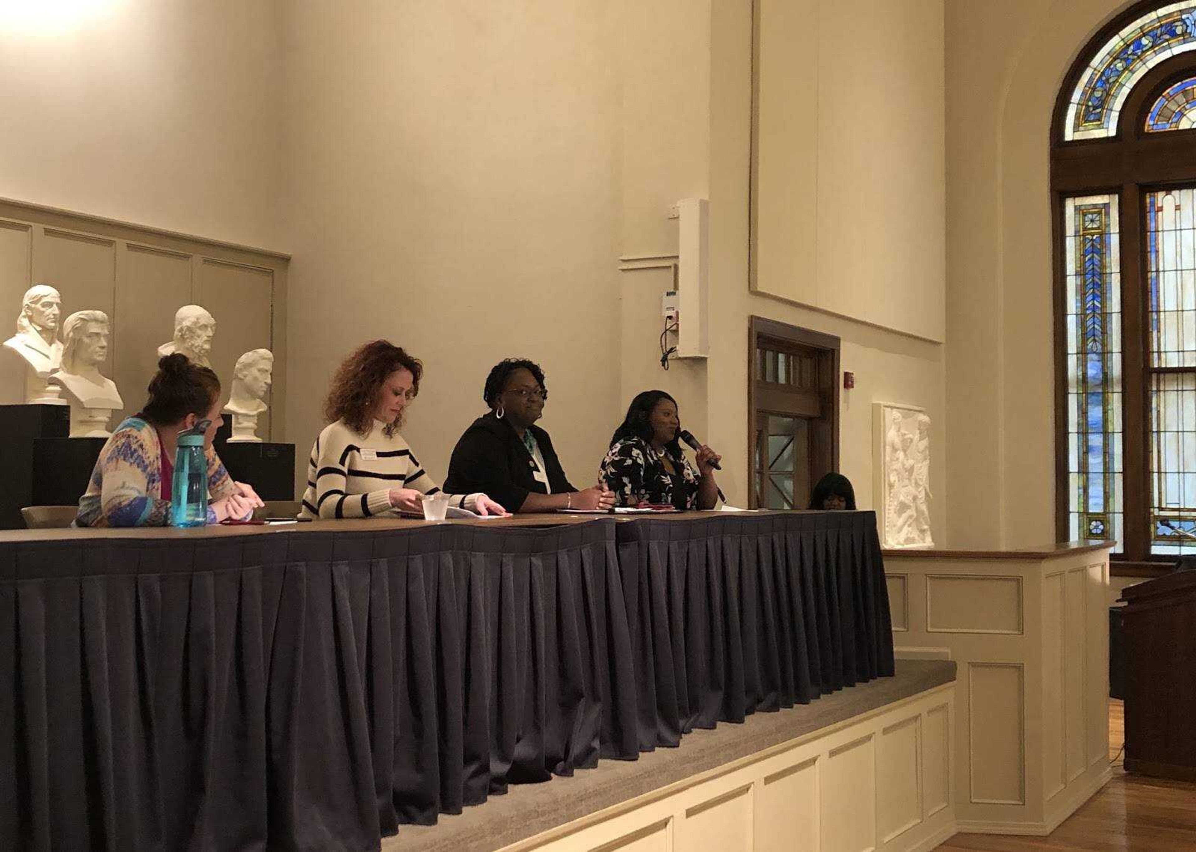 Panelists Sally Spalding, Erin Fluegge, Sonia Rucker, and Soni Lloyd (right to left) speak on pressing issues in the workplace.