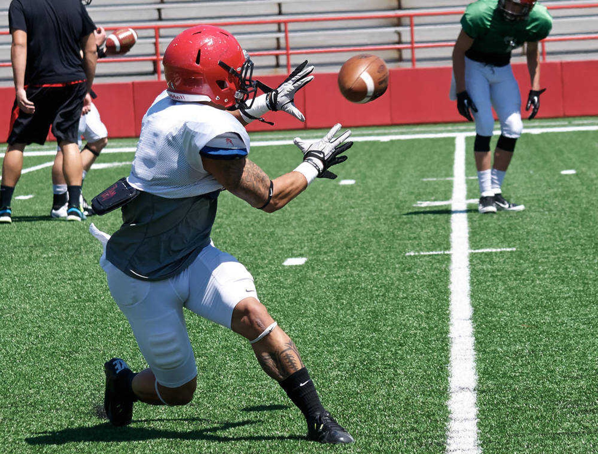 Spencer Davis receives the ball during practice on Aug. 20. Photo by Alyssa Brewer