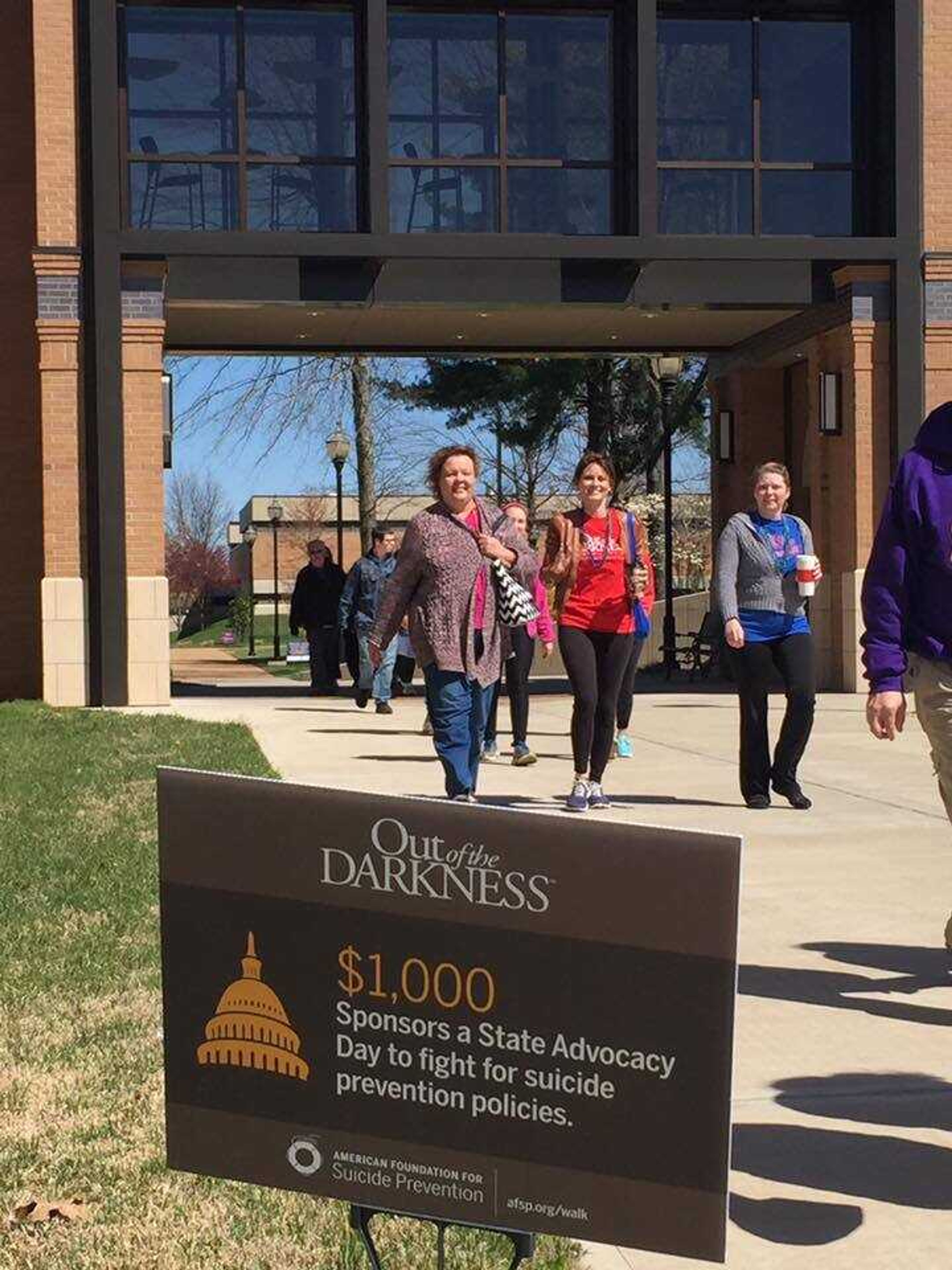 Supporters walk to raise awareness on suicide prevention during the Out of the Darkness community walk in 2015.
