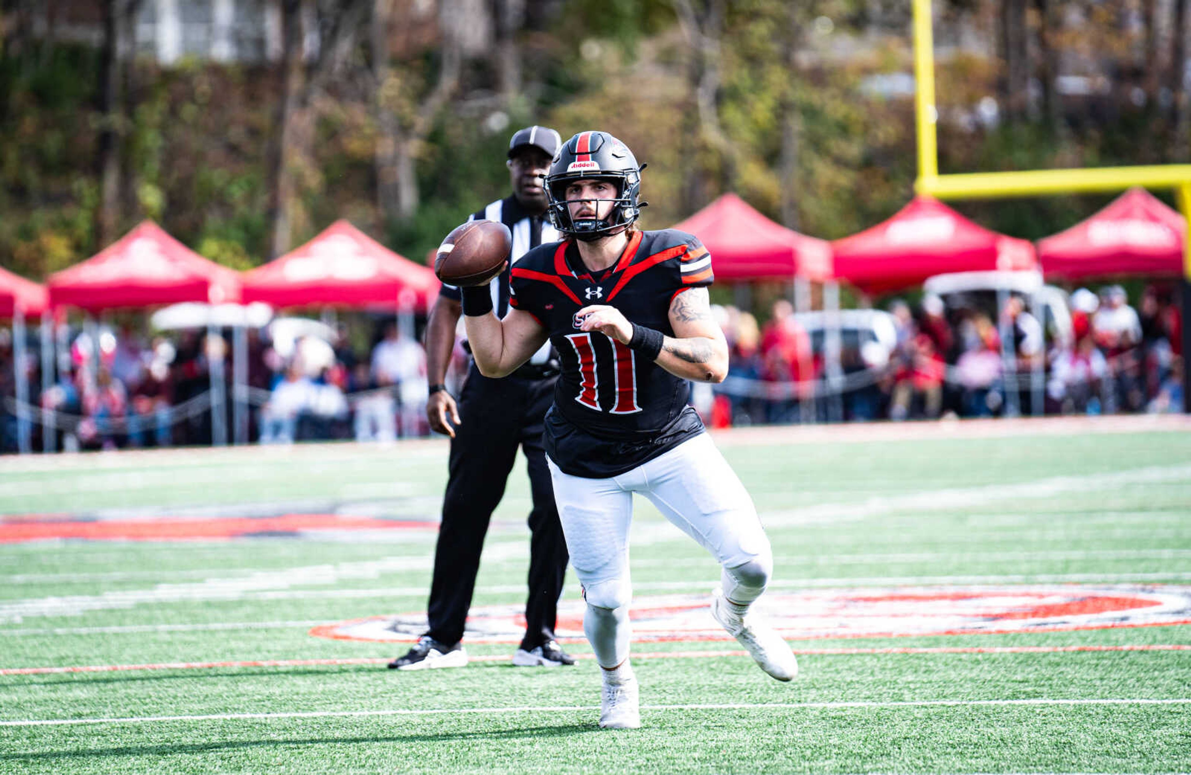 SEMO redshirt freshman quarterback (11) Patrick Heitert attempts a pass during SEMO's 21-20 loss against Robert Morris on Nov. 4 at Houck Field. Heitert threw for 144 yards one touchdown and one interception.