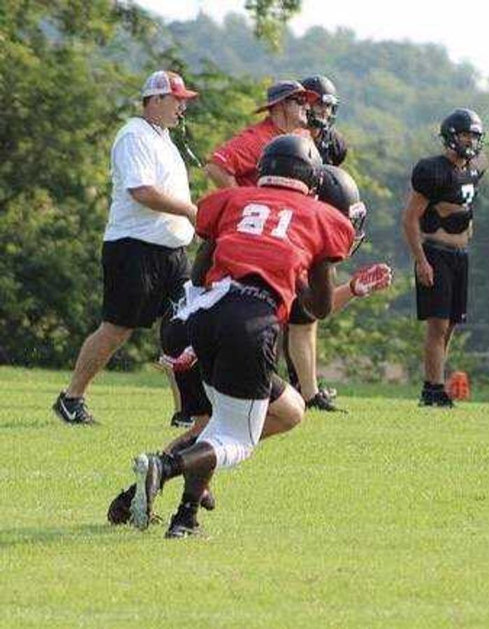 Redshirt junior Taj Jenkins covers a receiver during defensive drills in practice this summer. 