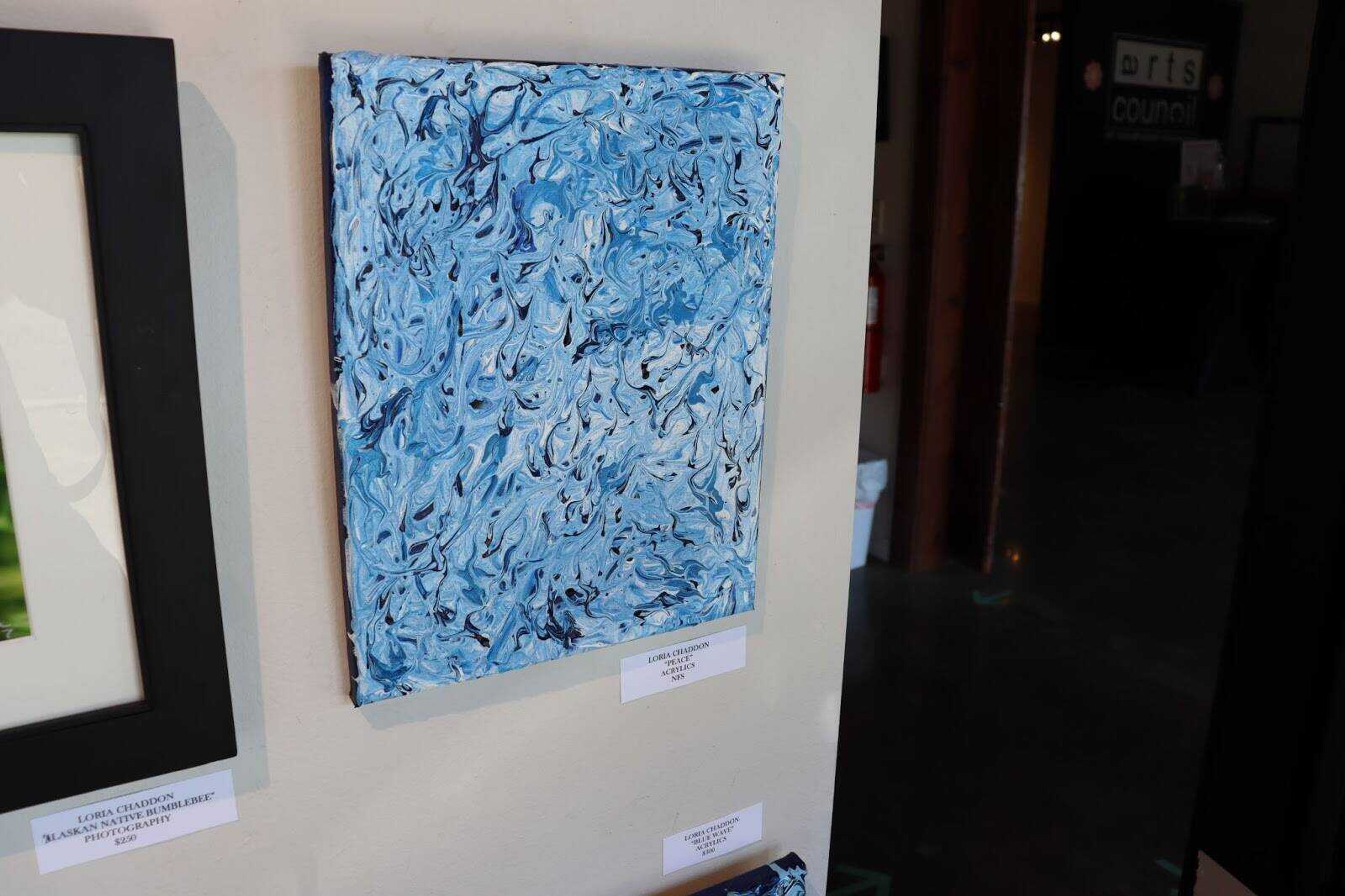 Loria Chaddon’s favorite painting in the Arts Council of Southeast Missouri’s window exhibit, titled “Peace.” The piece Loria Chaddon said to be one of the hardest to make but also the most rewarding.