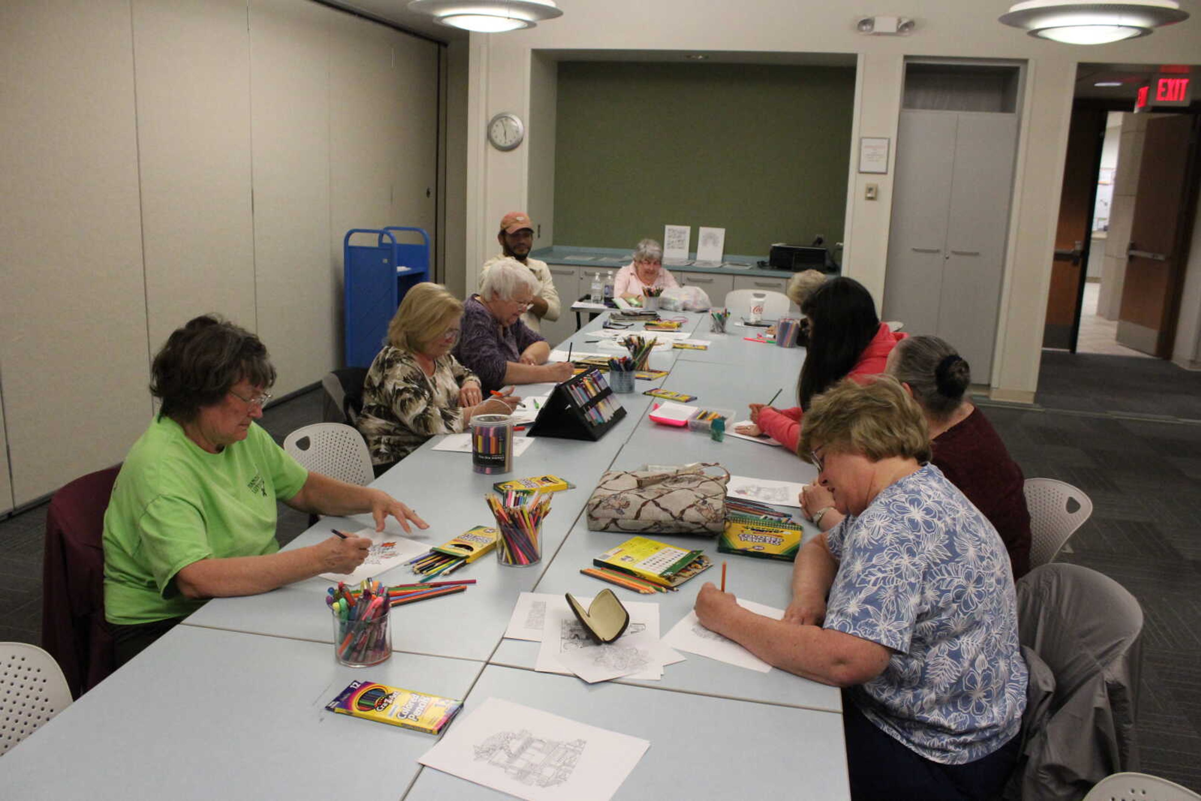 Guests color and socialize with each other at Cape Girardeau Public Library’s “Coloring for Adults” event on Oct. 24.