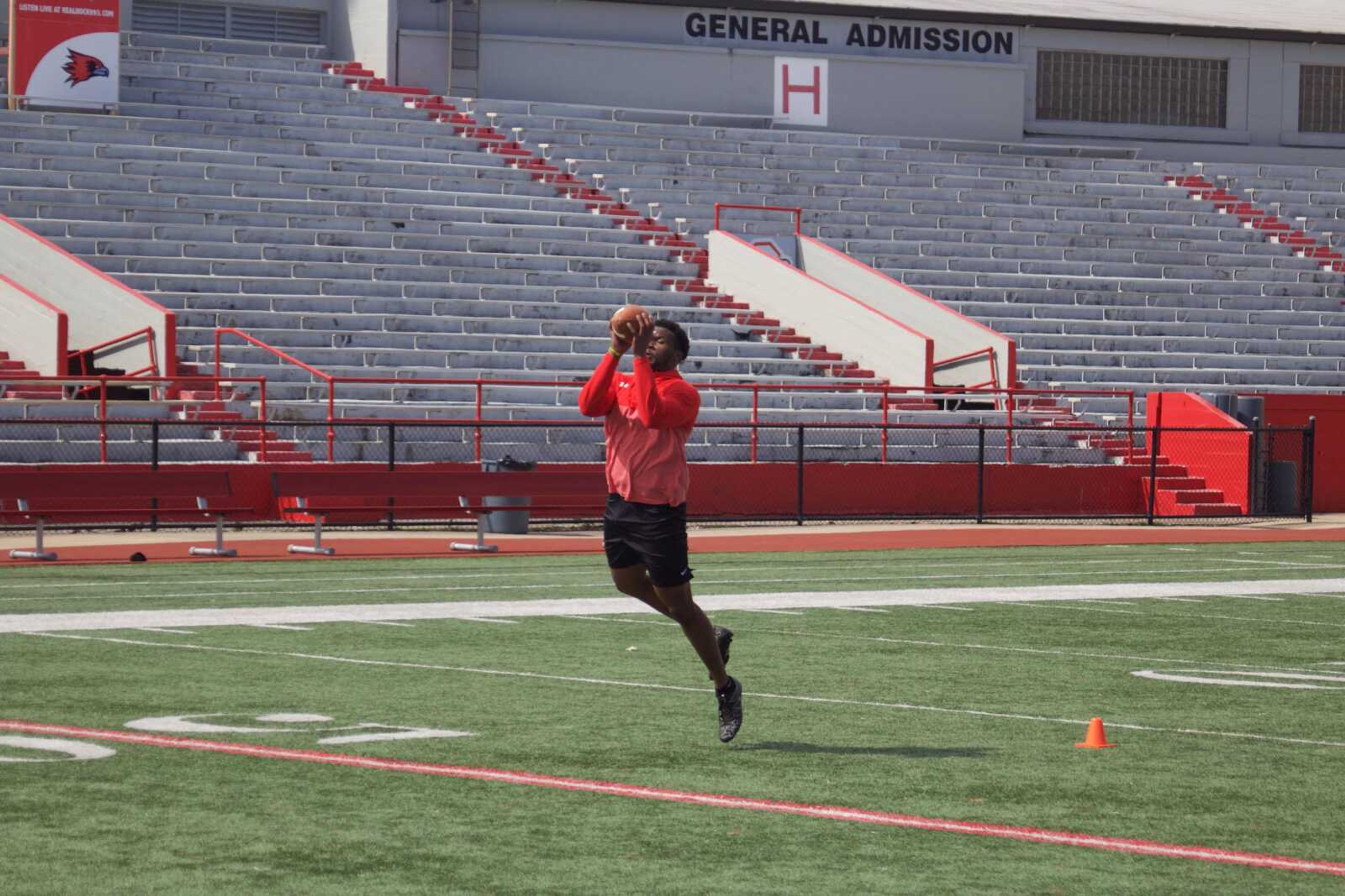 Senior linebacker Demarcus Rogers catches a pass during position drills at Southeast's pro day on March 26.