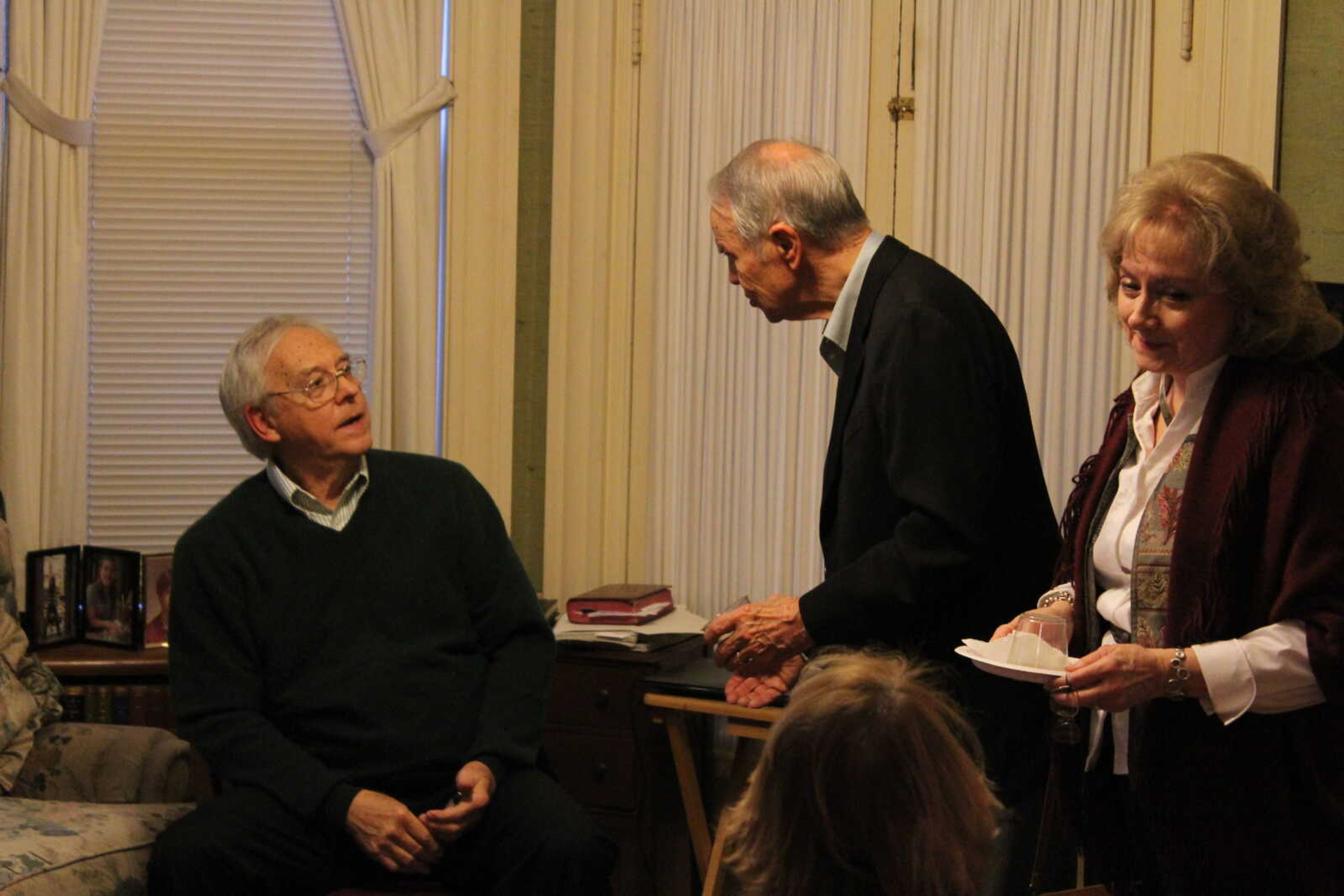 Dr. Robert Hamblin conversing with guest at the book launch reception on Nov. 8.