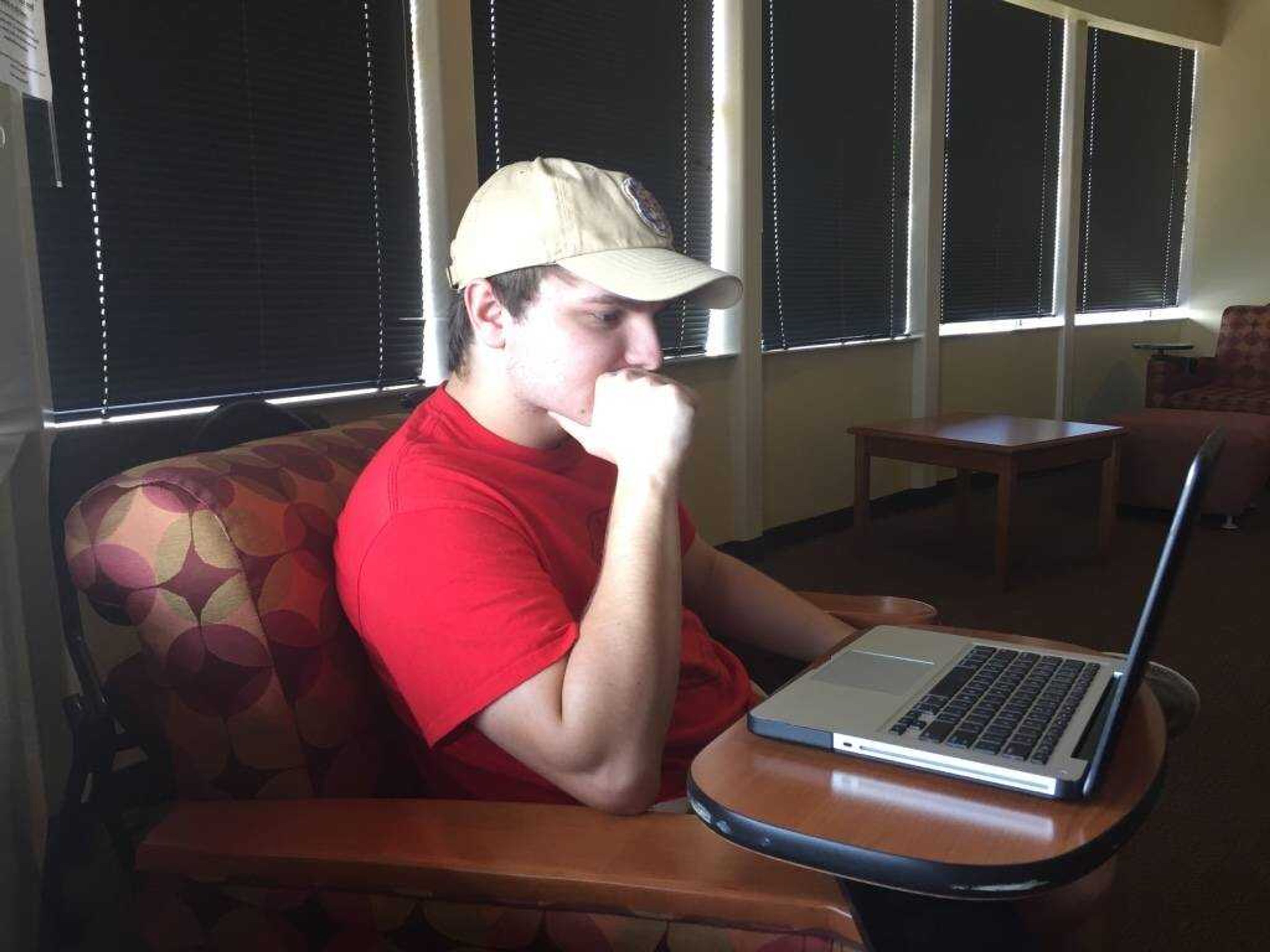 Sophomore Adam Smith makes decisions about who to put into his fantasy football lineups.