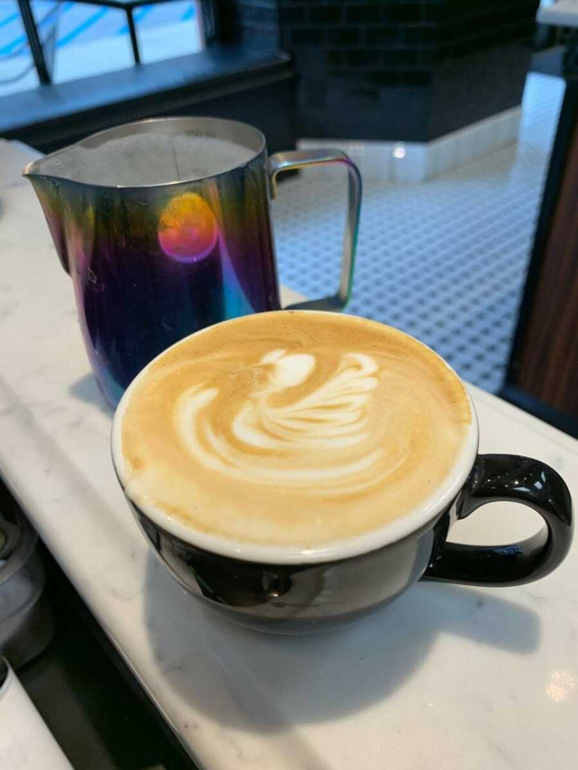 He arrives early to Baristas to practice latte art prior to the coffee shop’s opening. He takes a picture of each day’s creation; pictured above is a swan.
