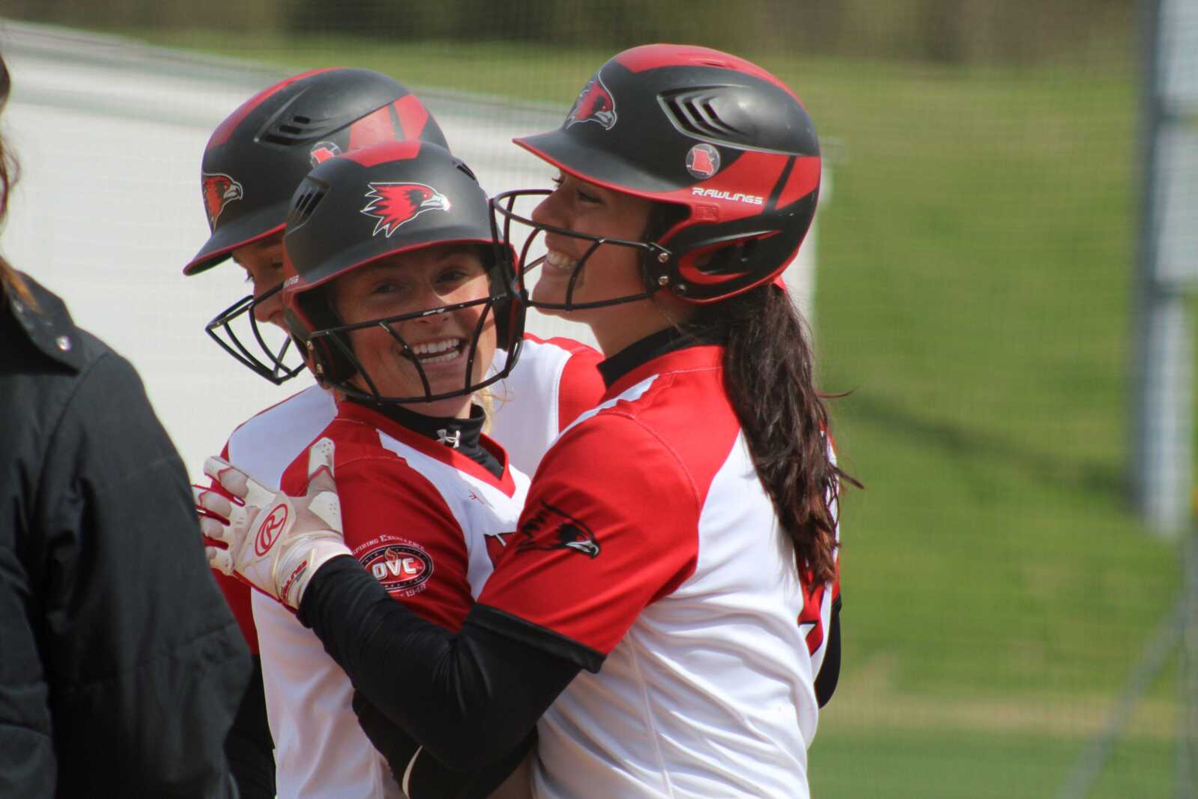 Junior Rachel Anderson (left) and Claudia Galio celebrate after Anderson hit a three-run home run in the fourth inning of a 9-7 win over Eastern Kentucky on April 1.