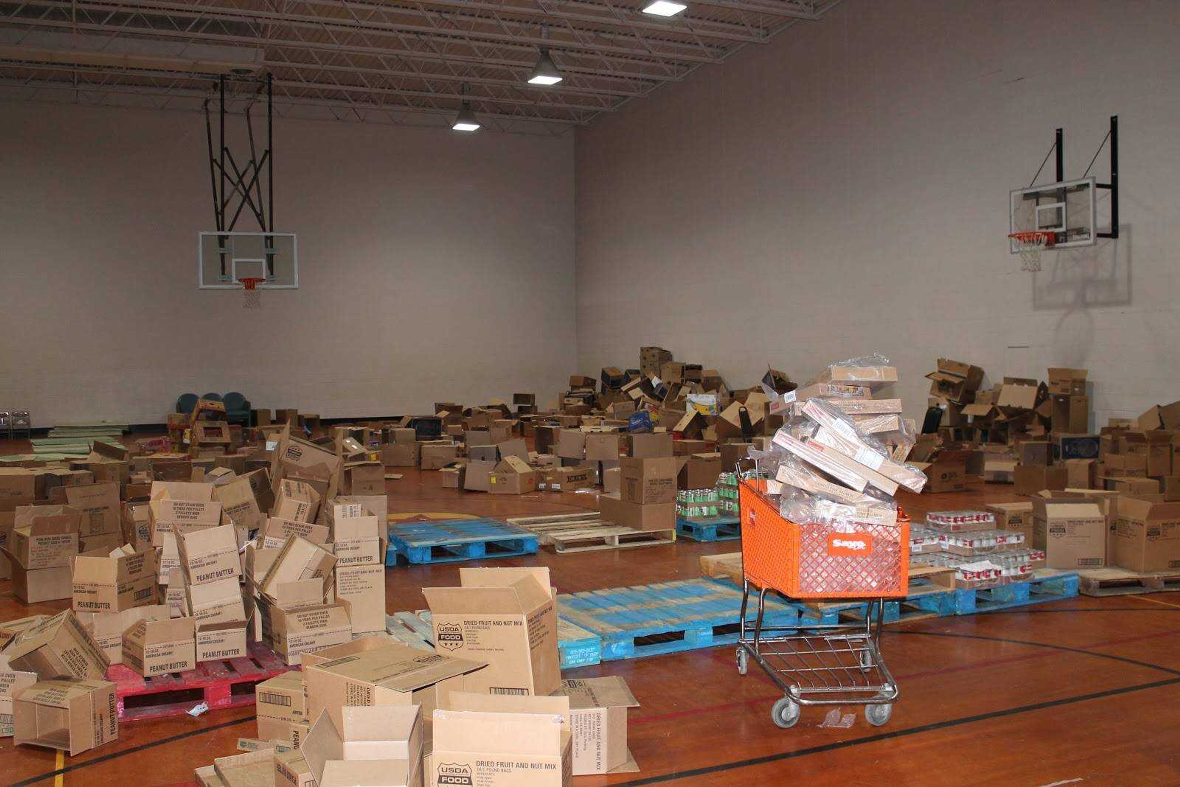 The gym at Red Star Baptist Church is filled with empty boxes after the food pantry team packaged donations to be distributed on Saturday, April 25.