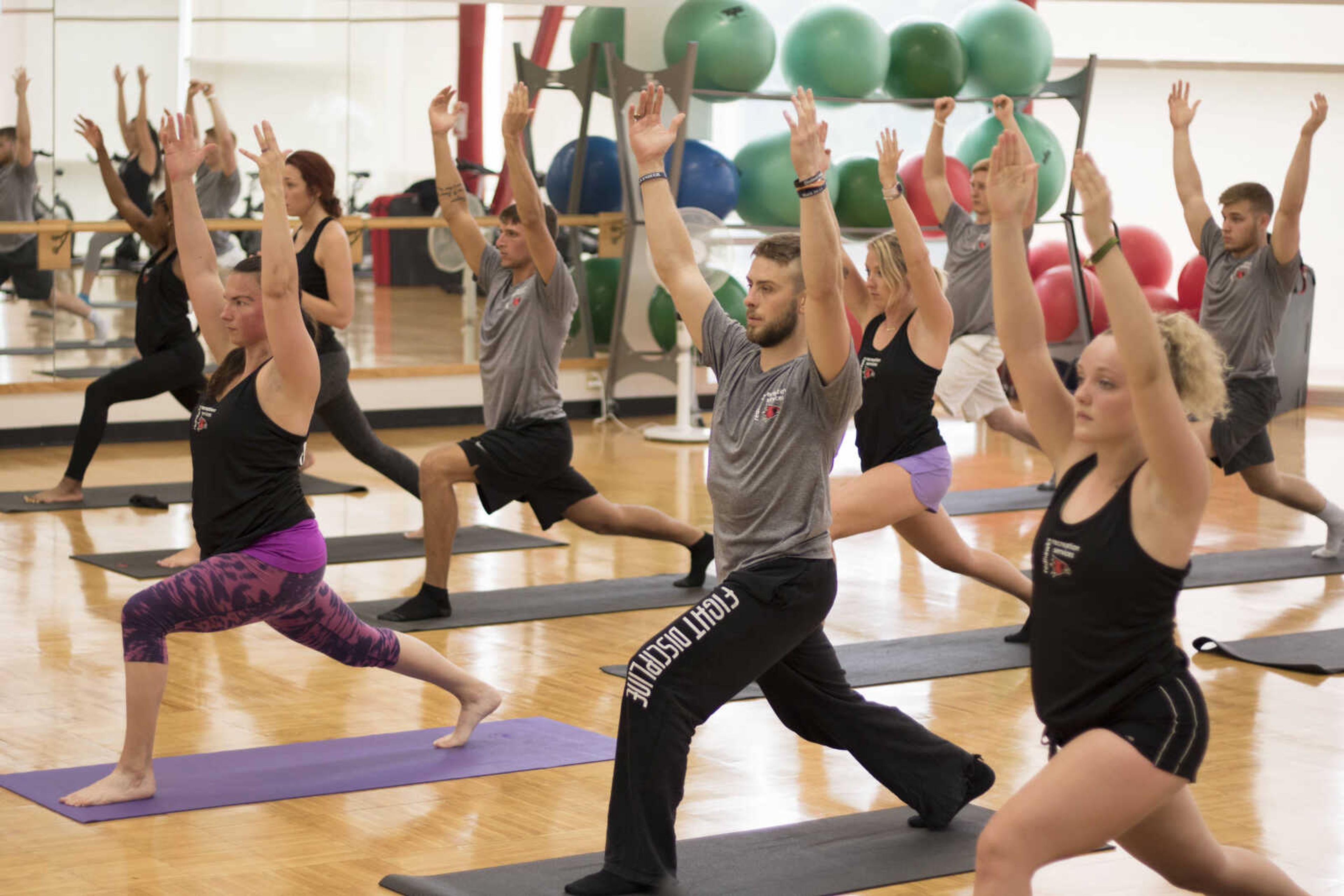 Southeast student fitness instructors participate in a yoga fitness class as part of their training Wednesday, Aug. 7.