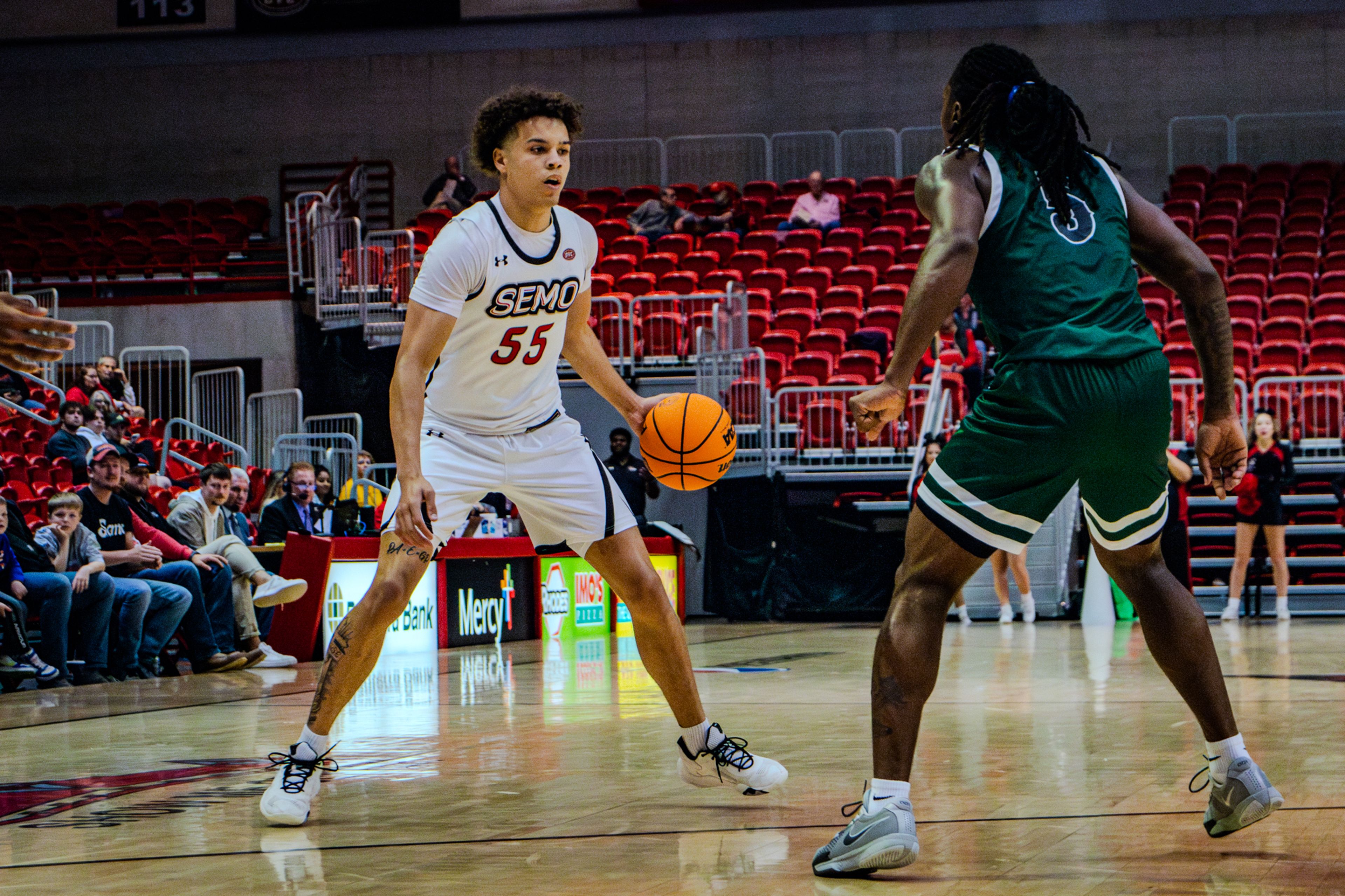 Sophomore guard Marqueas Bell dribbles against a Crowley Ridge college defender. 