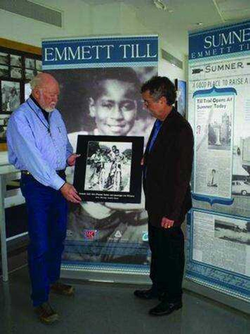 Luther Brown (left) and Henry Outlaw (right) with a photograph of Emmett Till. Submitted photo
