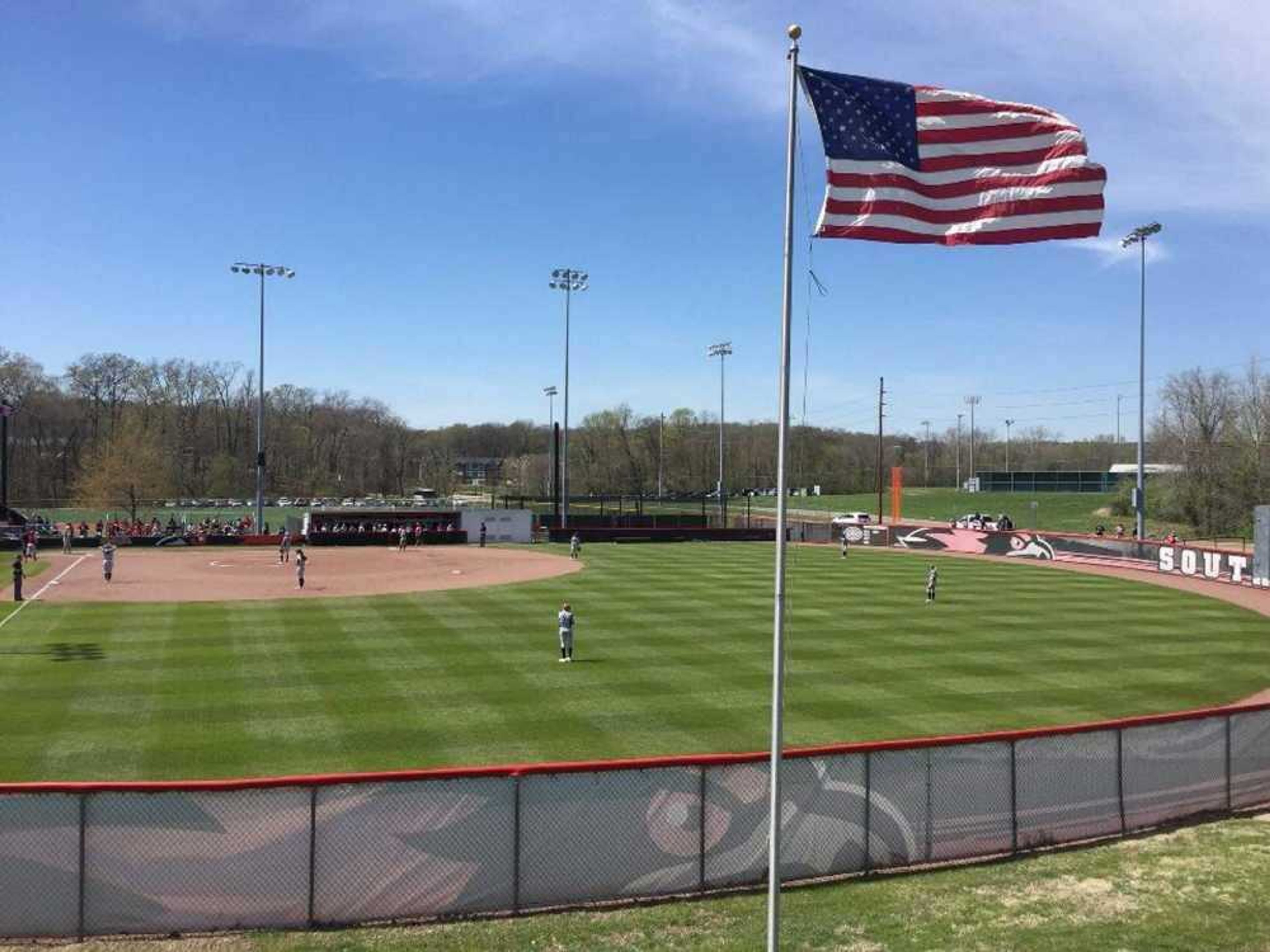 The American flag overlooks the Southeast Softball Complex on a clear day in 2017.