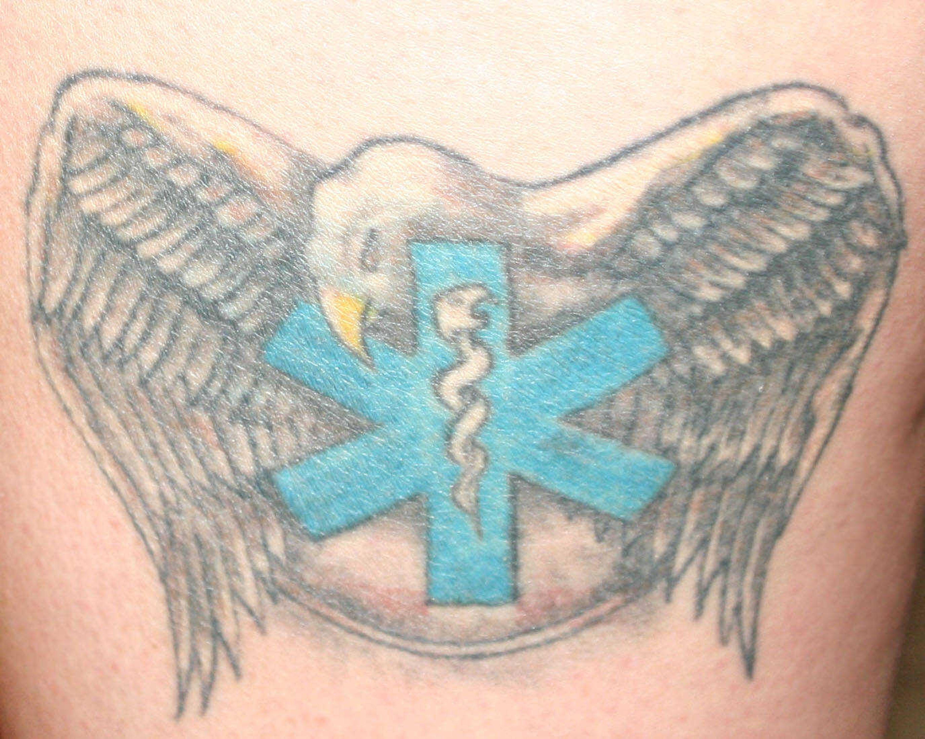 Rebekah Merritt's Tattoo of a star of life with an eagle surrounding it.