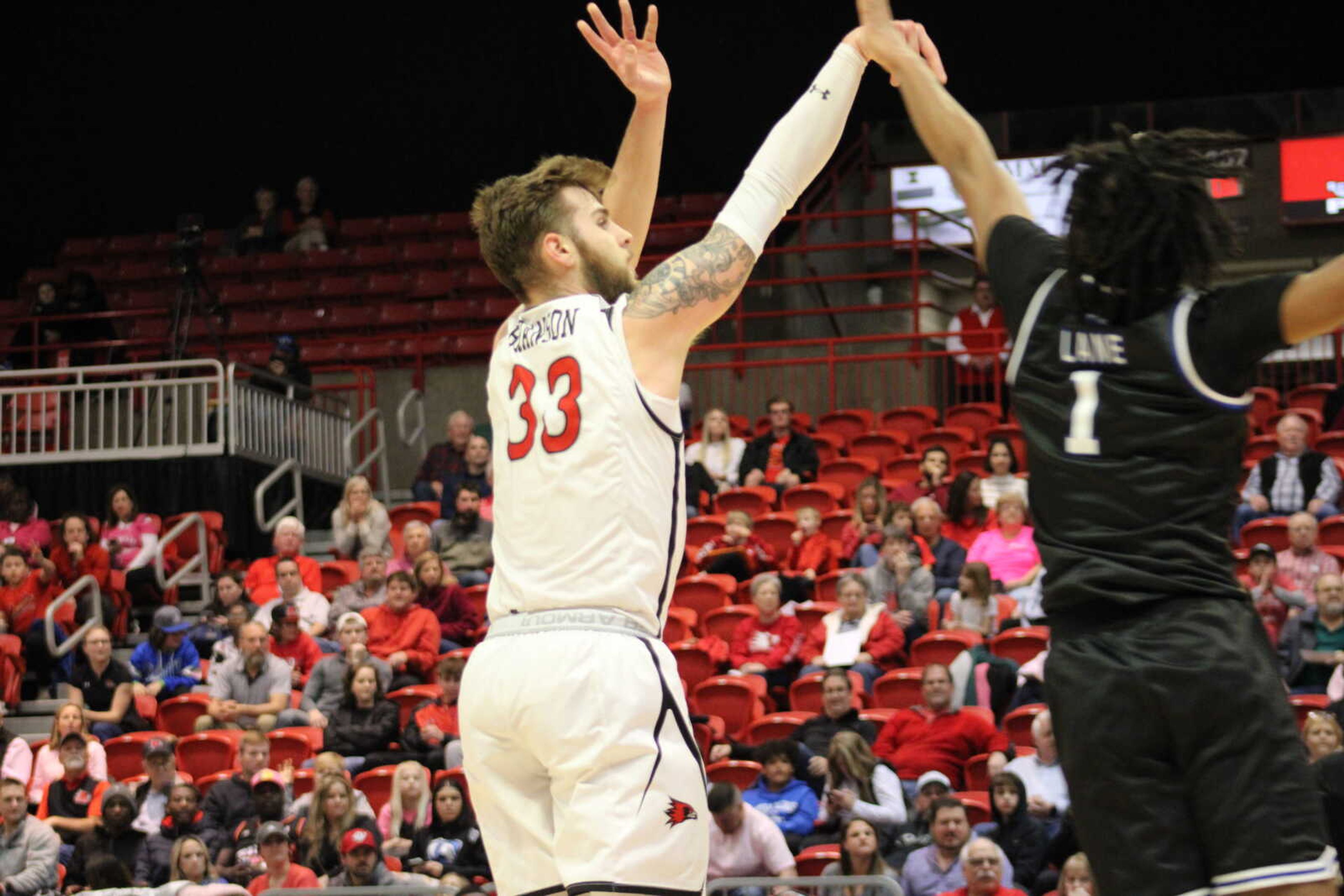 Sophomore guard Dylan Branson (33) shoots a three pointer over Eastern Illinois' CJ Lane (1).
