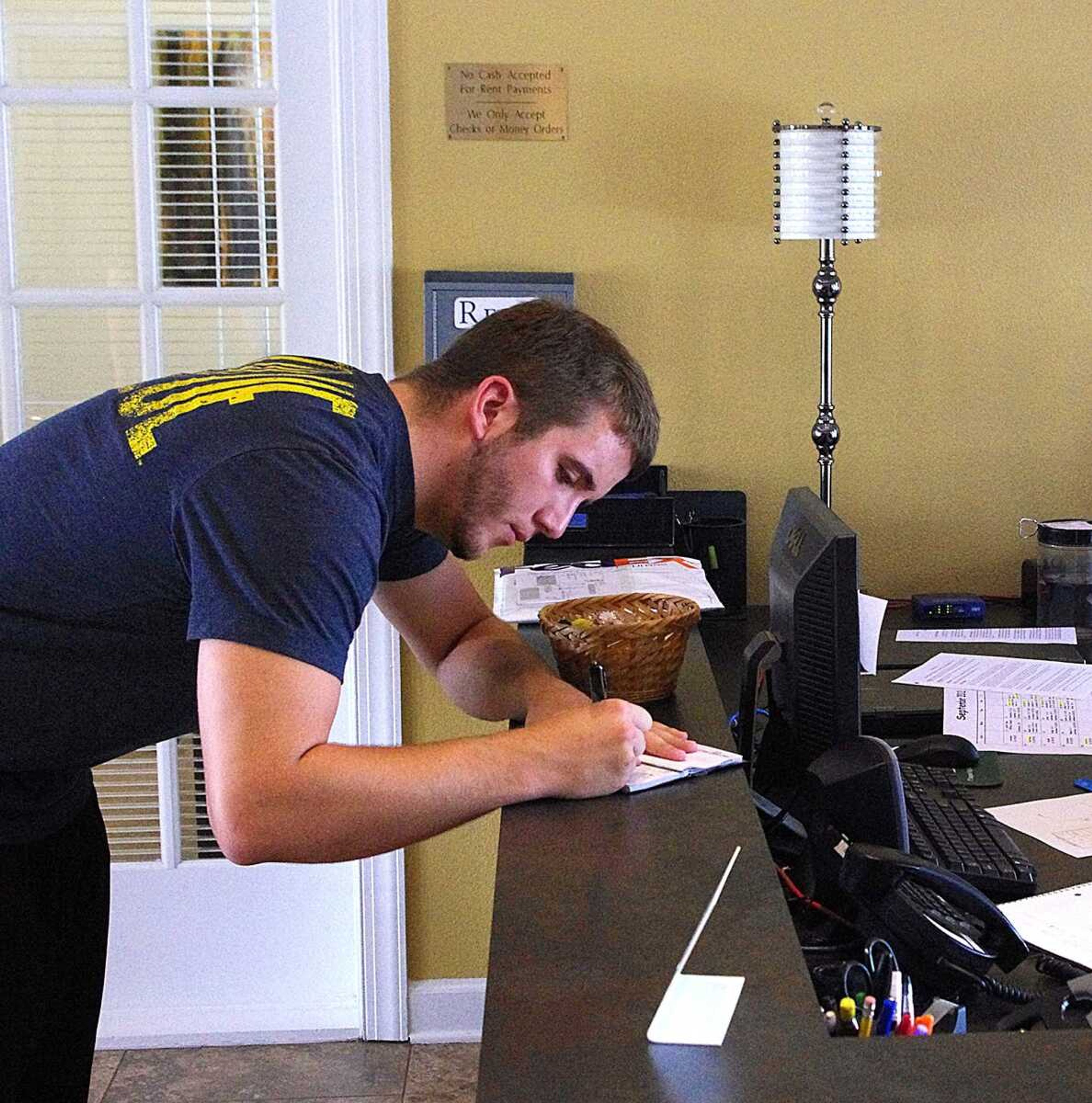 Cape Trails resident Charles Powell stops in the main office to pay his rent. Photo by Nathan Hamilton