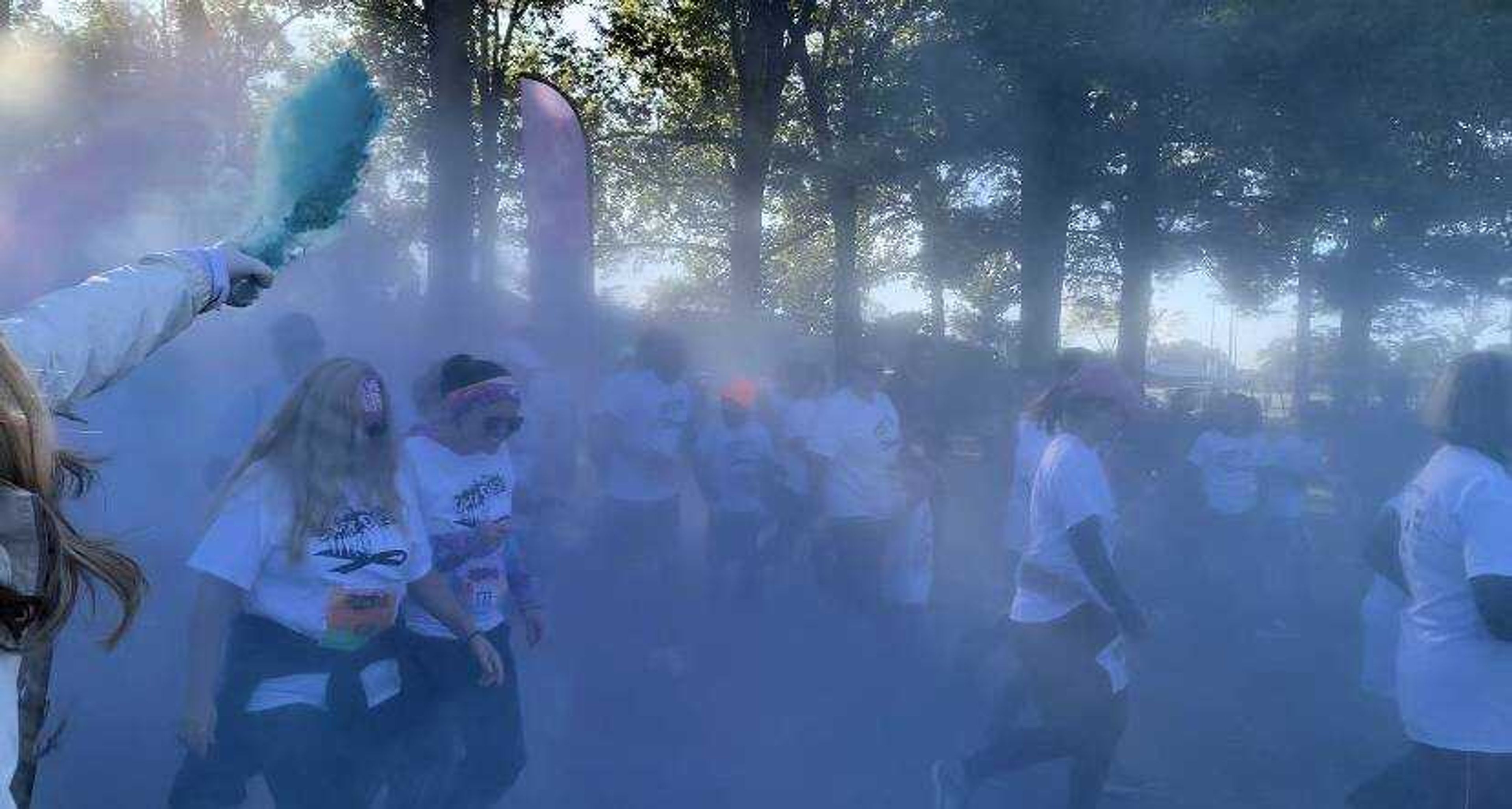 St. Francis Employees kicking off the Color Run 5k by raining color chalk in the air at Arena Park, Oct. 12 in Cape Girardeau, Missouri.
