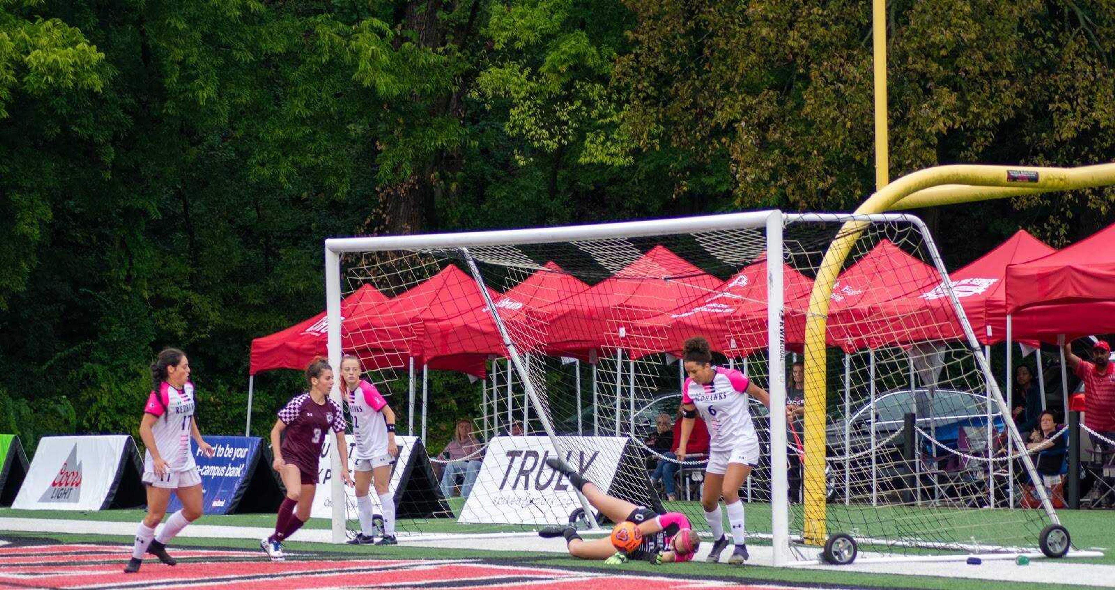 Sophomore goalkeeper Bailey Redden makes a save against SIU on Oct. 6 at Houck Field. Redden received a red card in the Redhawks final regular season game.