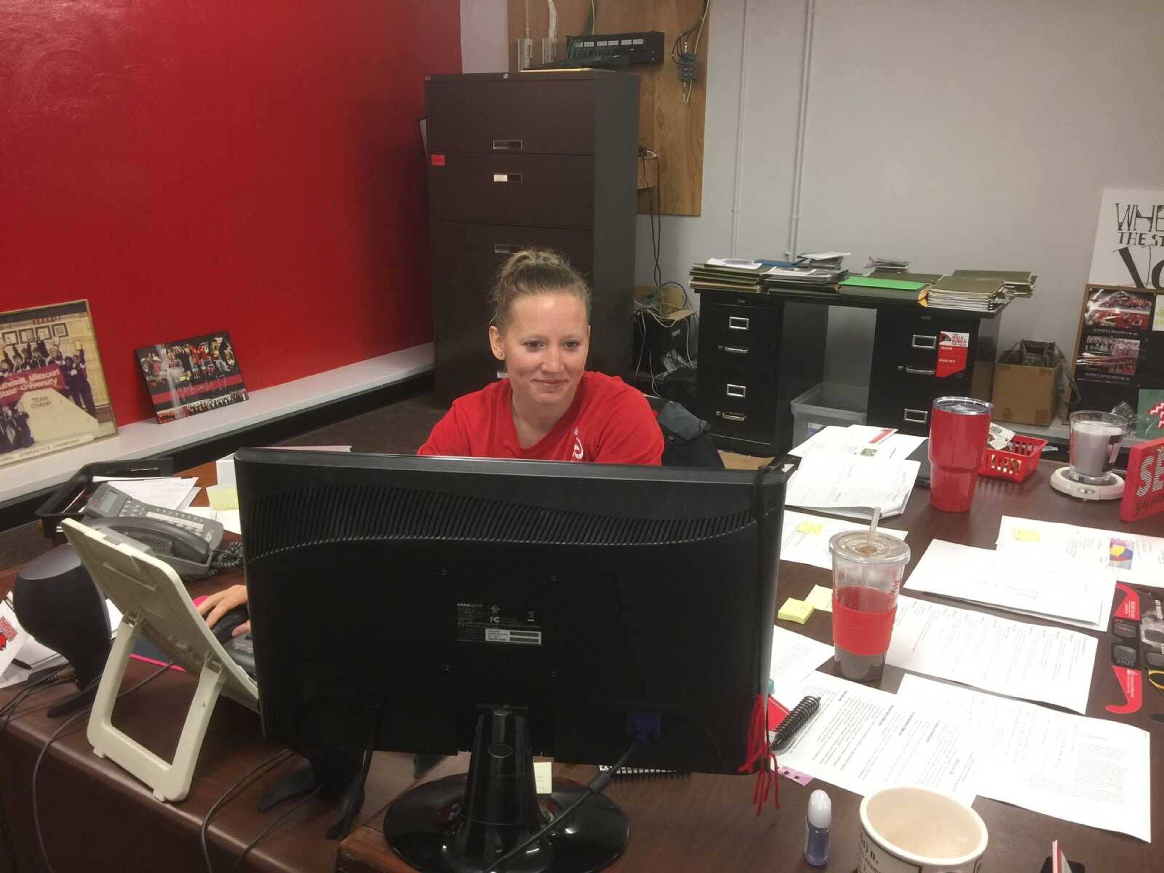 In between practices, phone calls and emails. Southeast Women's Gymnastics head coach Kristi Ewasko works on homework for her degree program.      