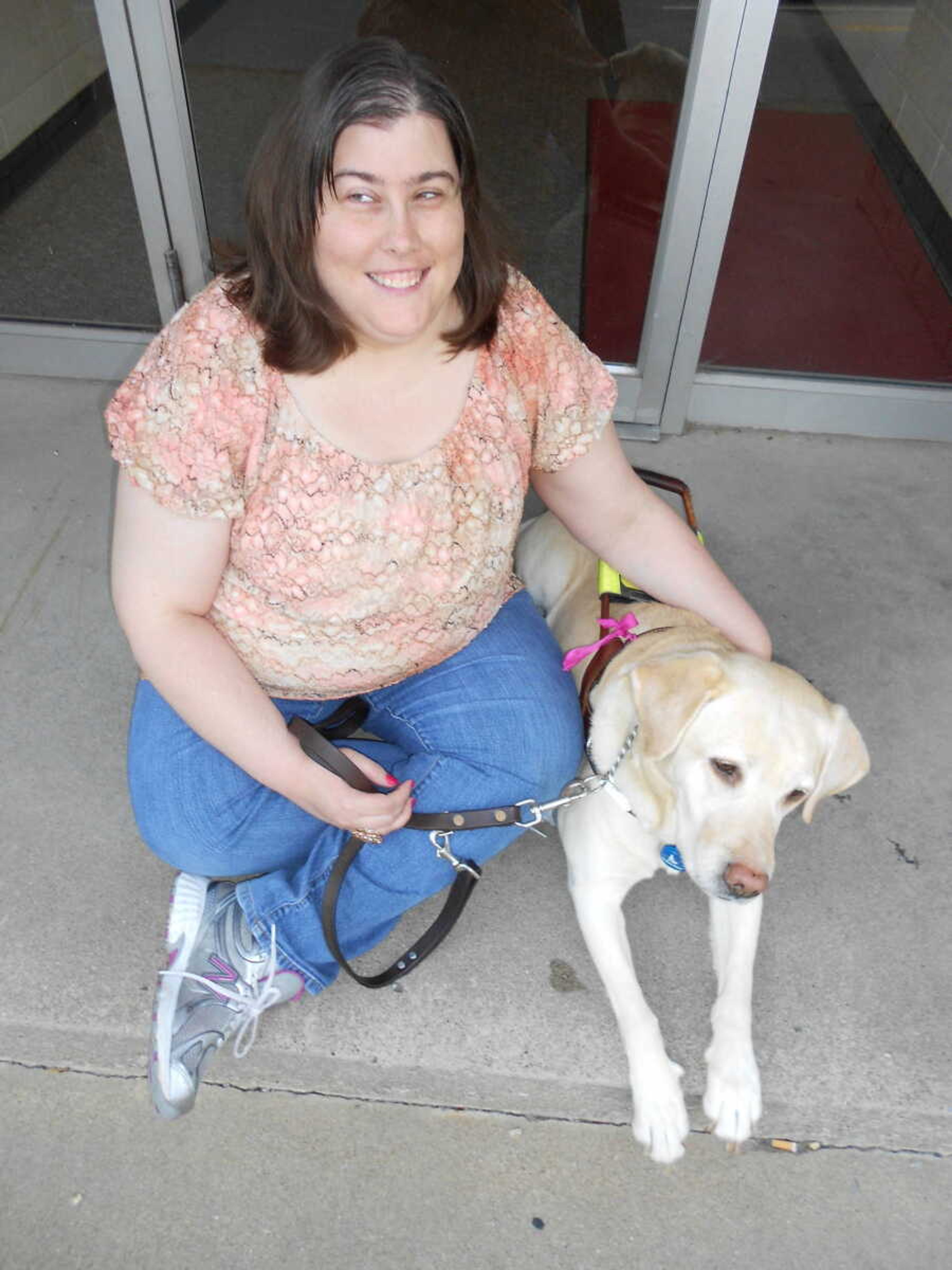 Sindy Puckett and her dog Elanor will walk at graduation together. - Submitted photos