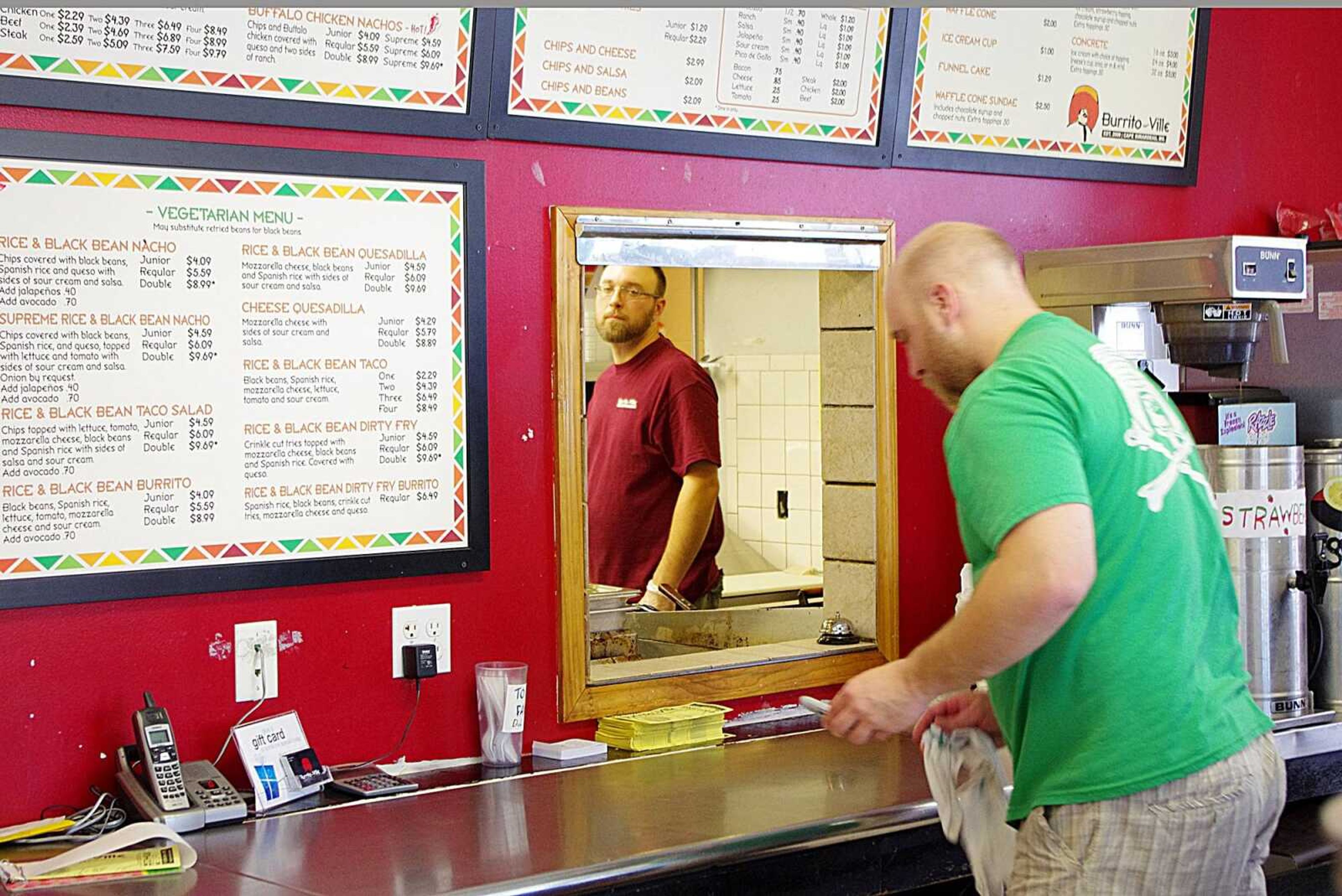 Jason Mungle, left, and Jeff Mungle, right, are members of the Burritoville staff. Photo by Nathan Hamilton