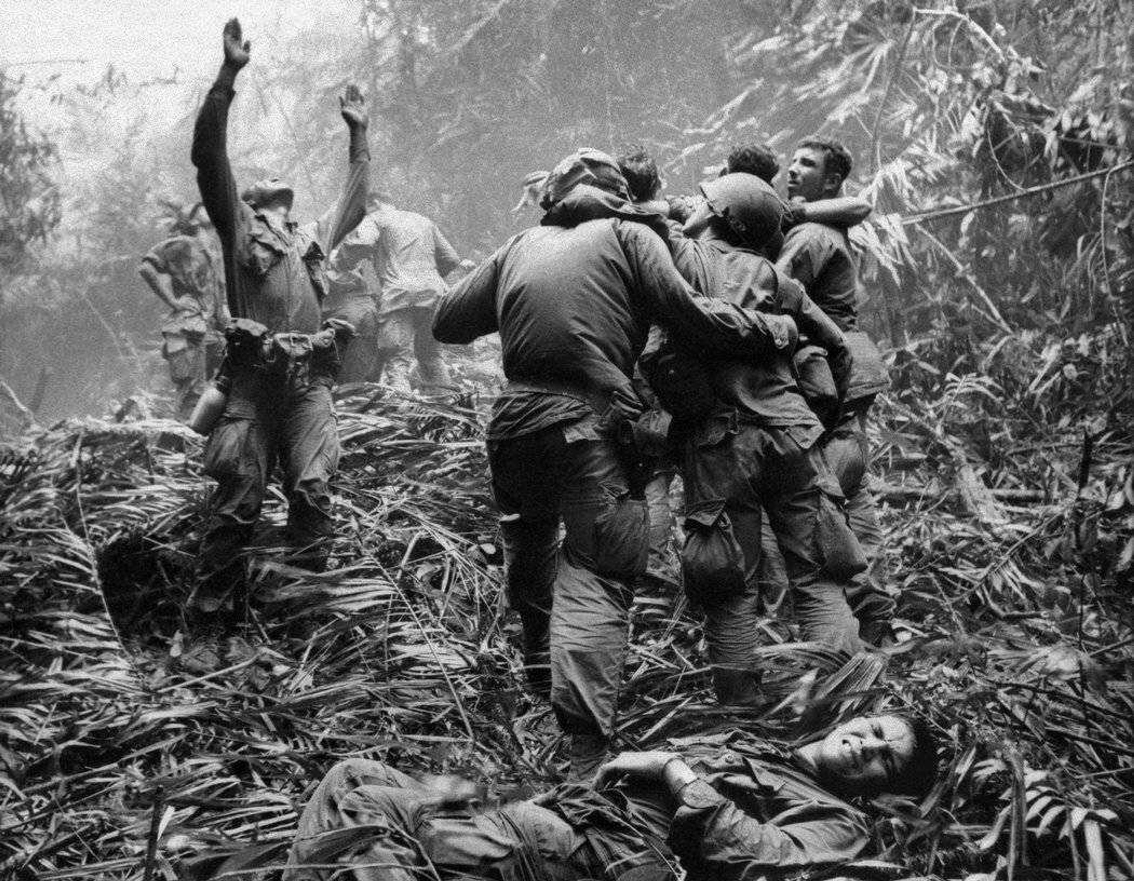 Marine Grunts make ready for an arriving Medivac helicopter in the aftermath of battle through deep jungle.