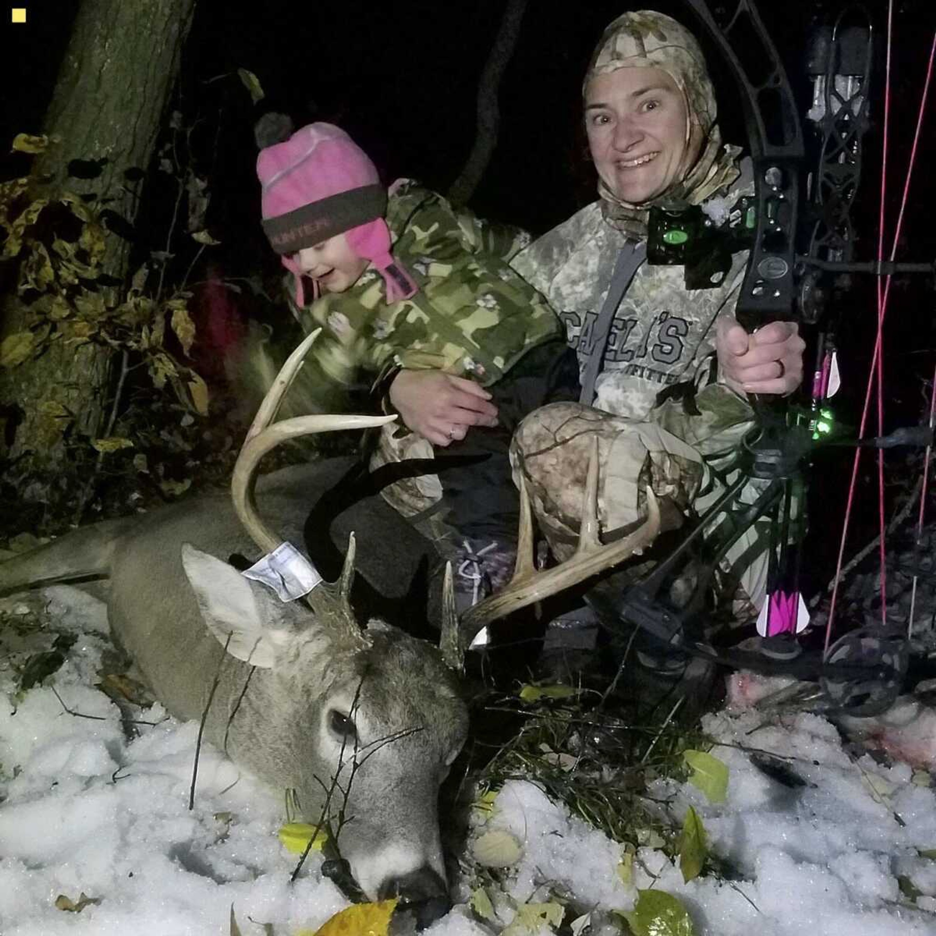 Wildlife ecology and management associate professor Susan Felege poses with daughter and a big buck. Felege says having a child has never stopped her from hunting.