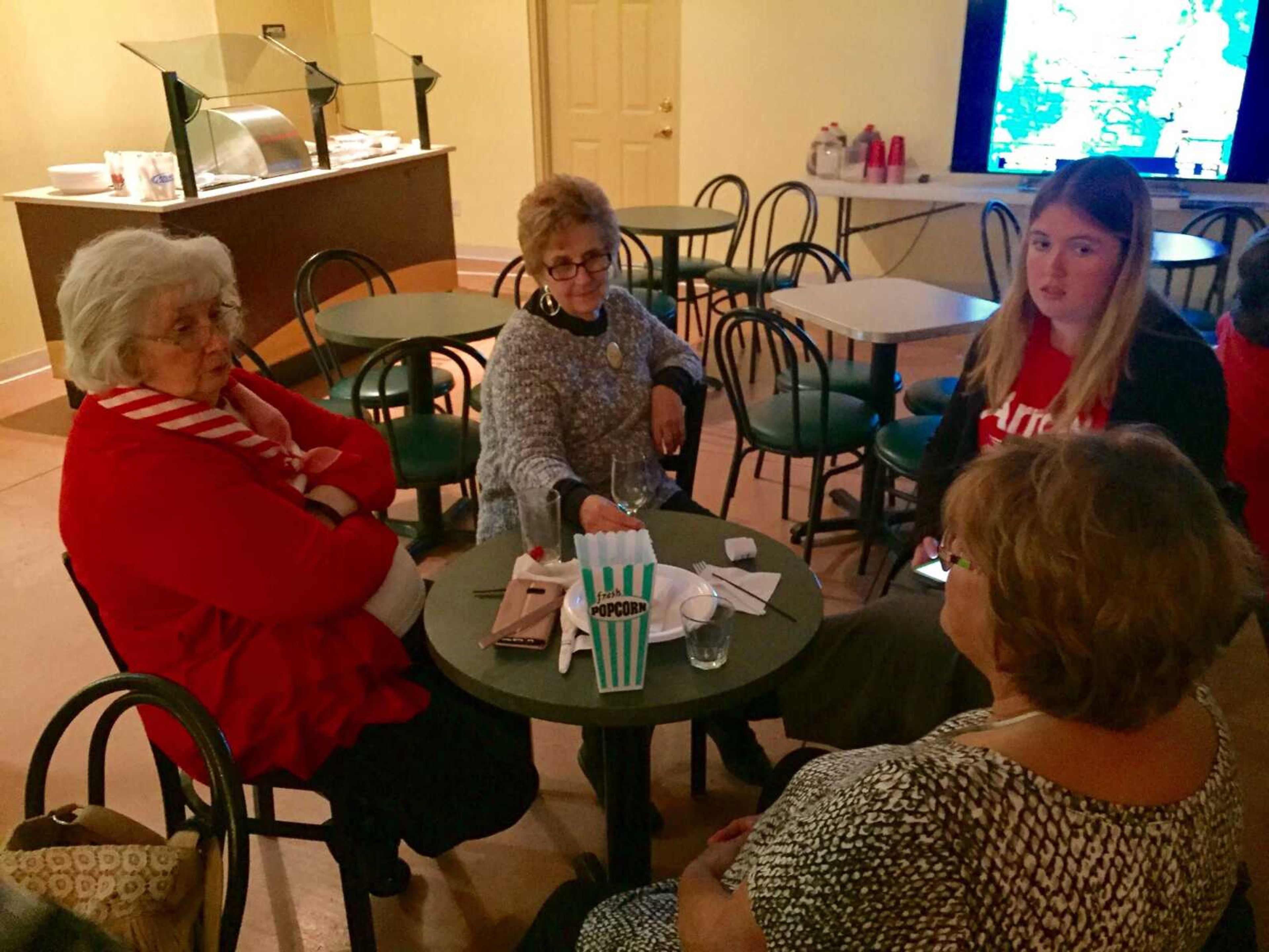 Women at the Democratic watch party discuss the nations issues.