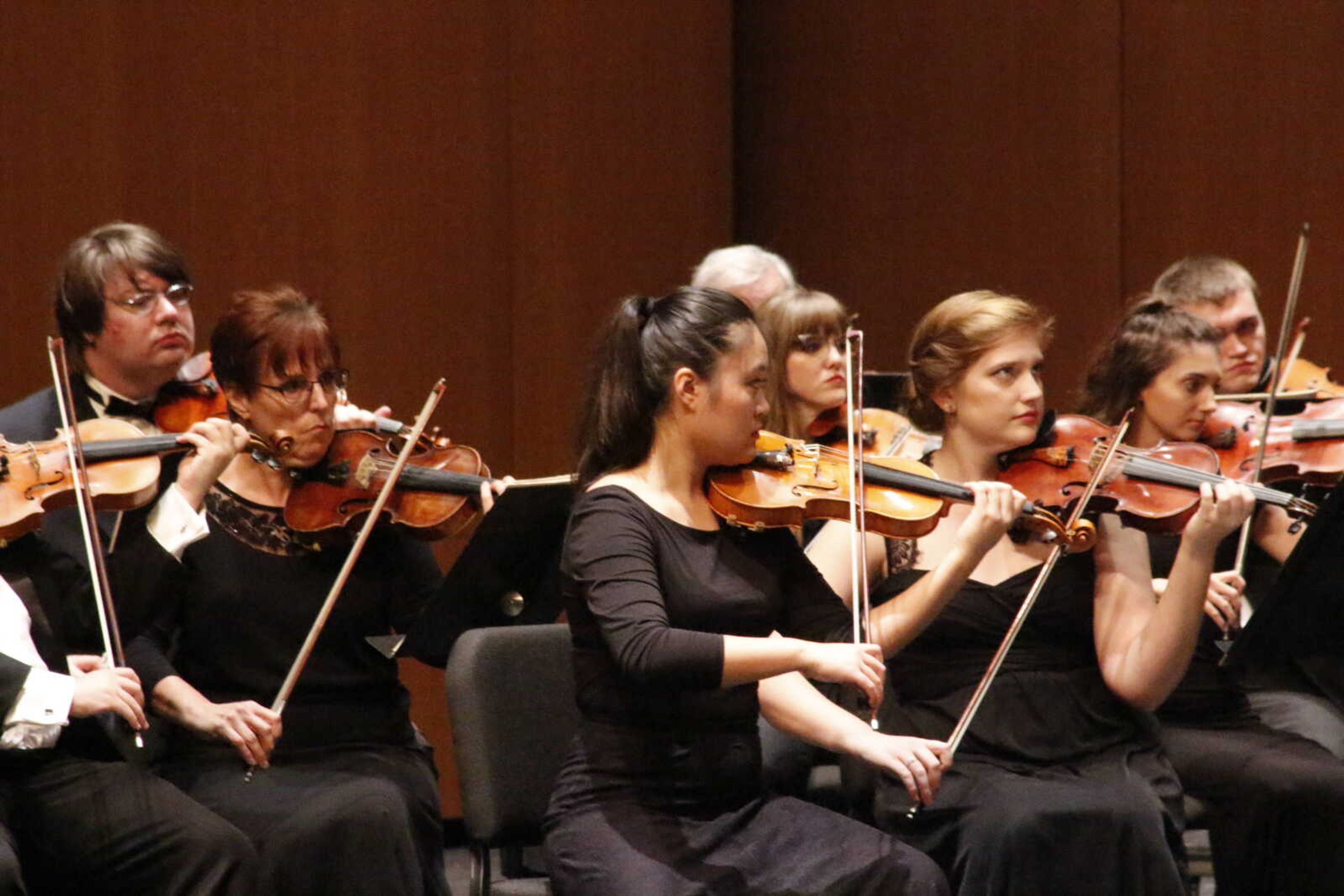 Southeast professor and concertmaster Sophia Han leads the Southeast Missouri Symphony Orchestra in a piece during the Gala Symphony opening concert in Bedell Hall on Oct. 10.
