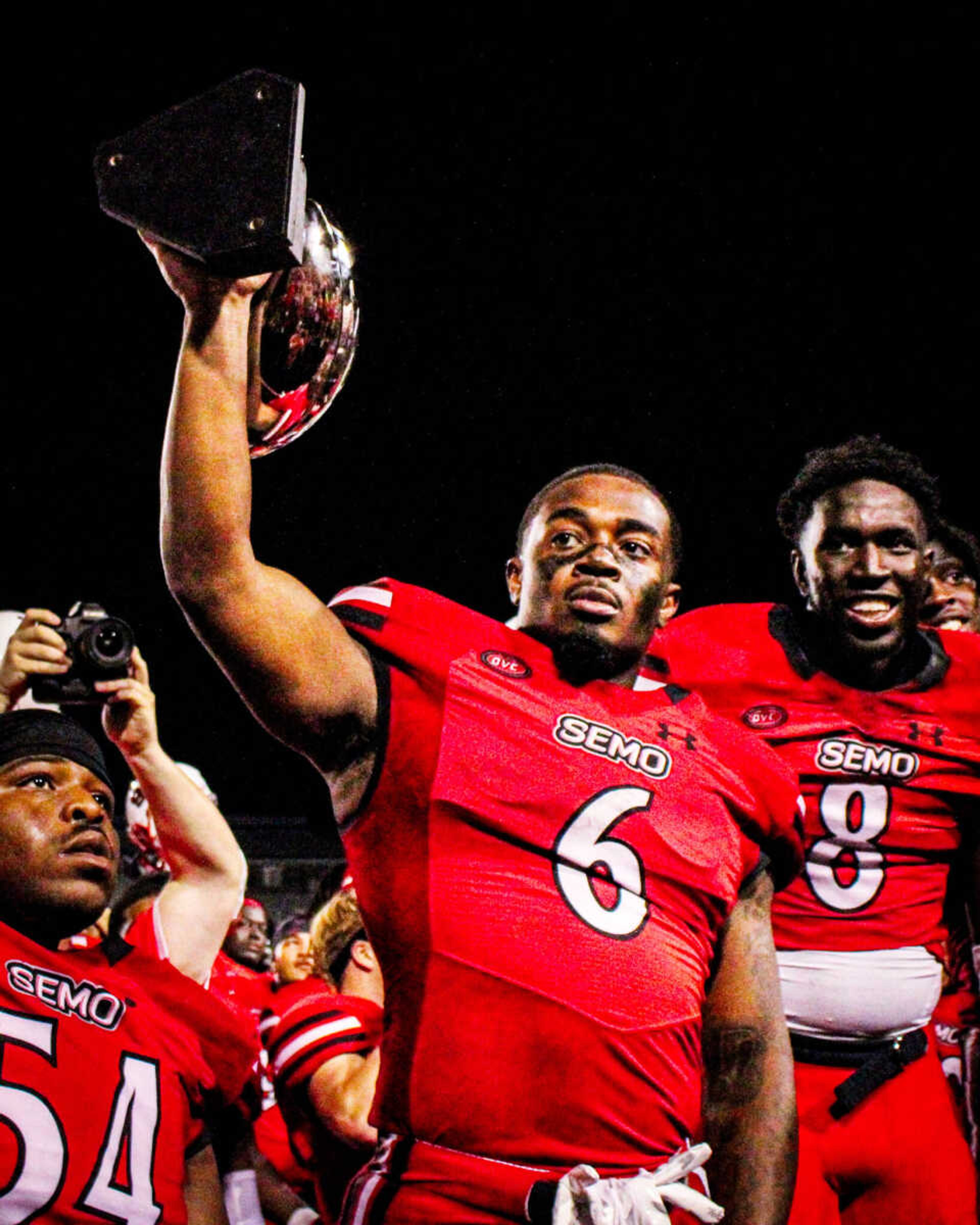 Running back Geno Hess hoists the Gameball Brawl trophy after SEMO’s 45-7 victory against Lindenwood University. Hess ended the game with 115 rushing yards and 2 touchdowns.