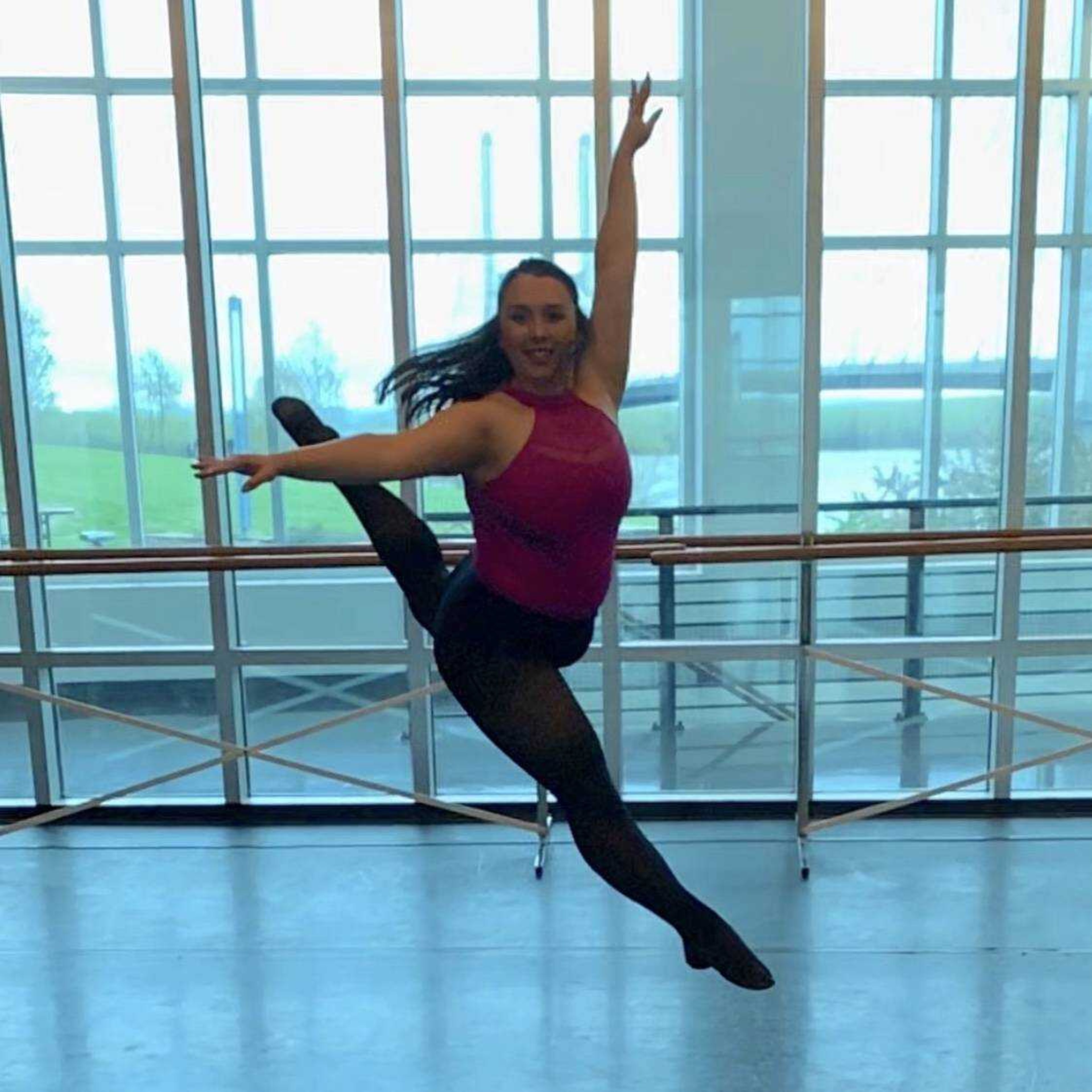 Lizzie Madden dancing in Southeast dance studio on River Campus. 