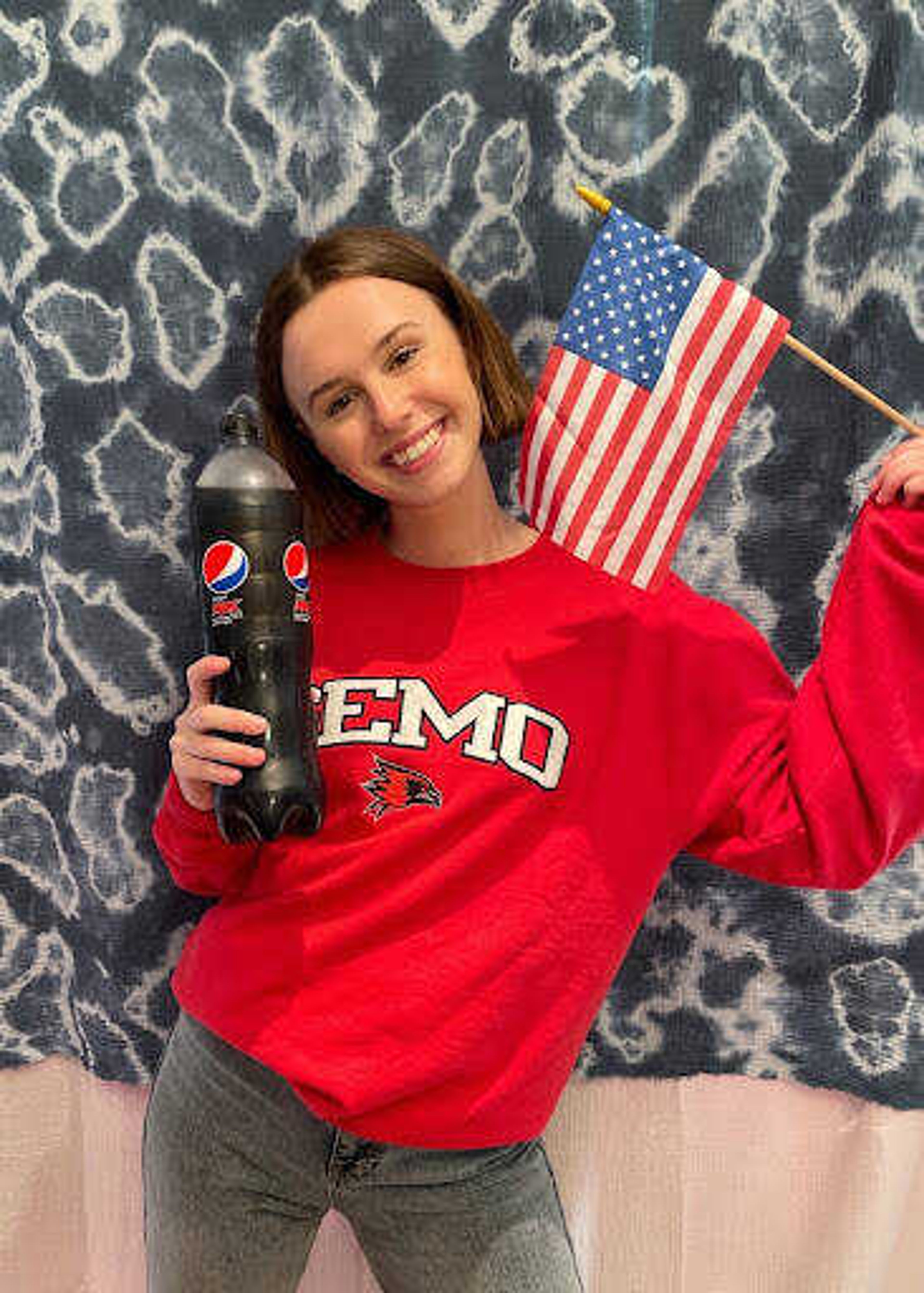 Kika Rooselaer poses with a Pepsi bottle in her SEMO sweatshirt. Rooselaer worked from home, but still held America and her SEMO friends close to her heart during her time at PepsiCo Europe. 