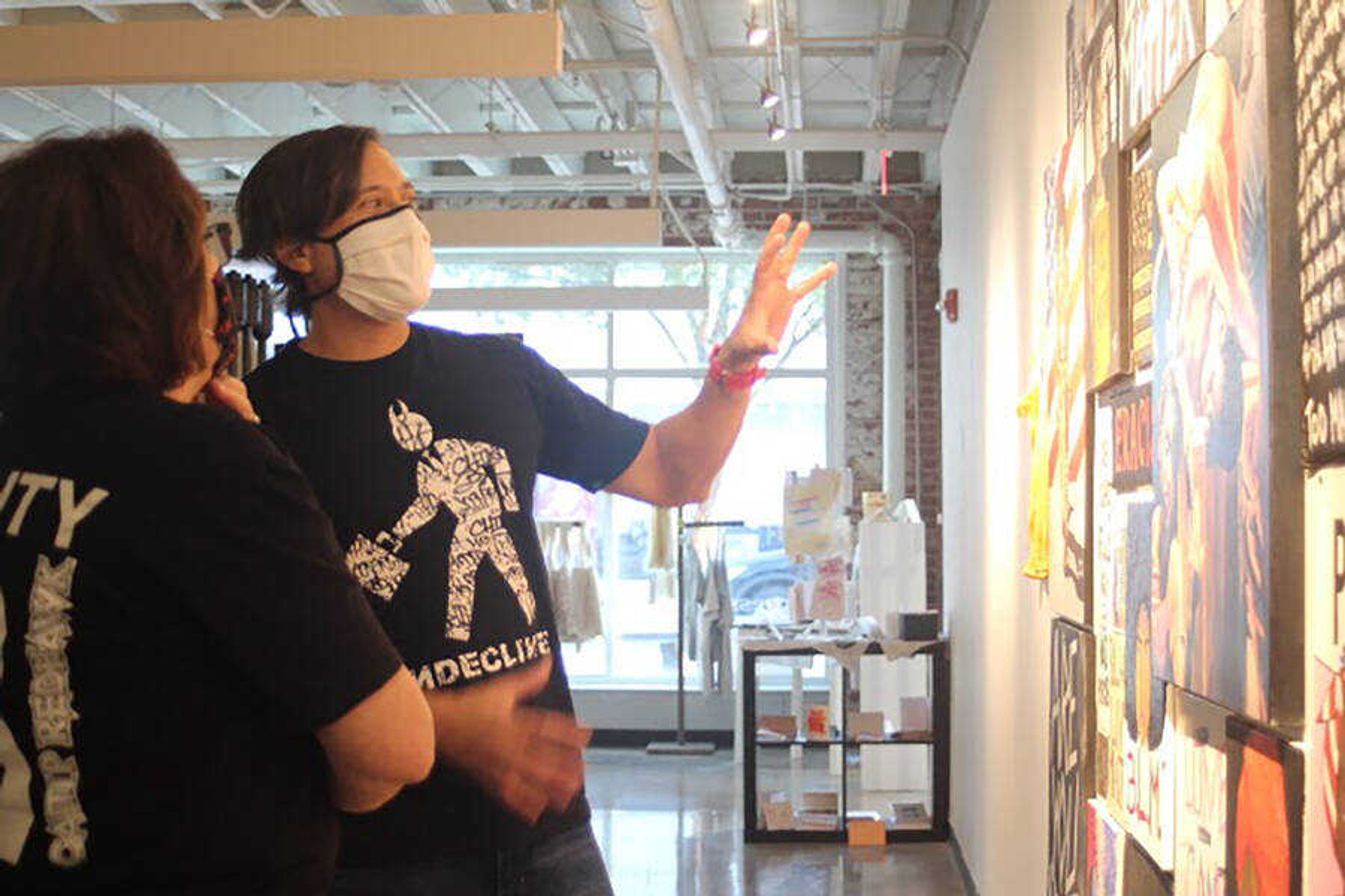 Professor Benjie Heu speaks about the Black Lives Matter exhibit with Rhonda Weller-Stilson during the gallery opening on September 4. The gallery contains artwork from Southeast faculty and students, including four of Heu’s original pieces.