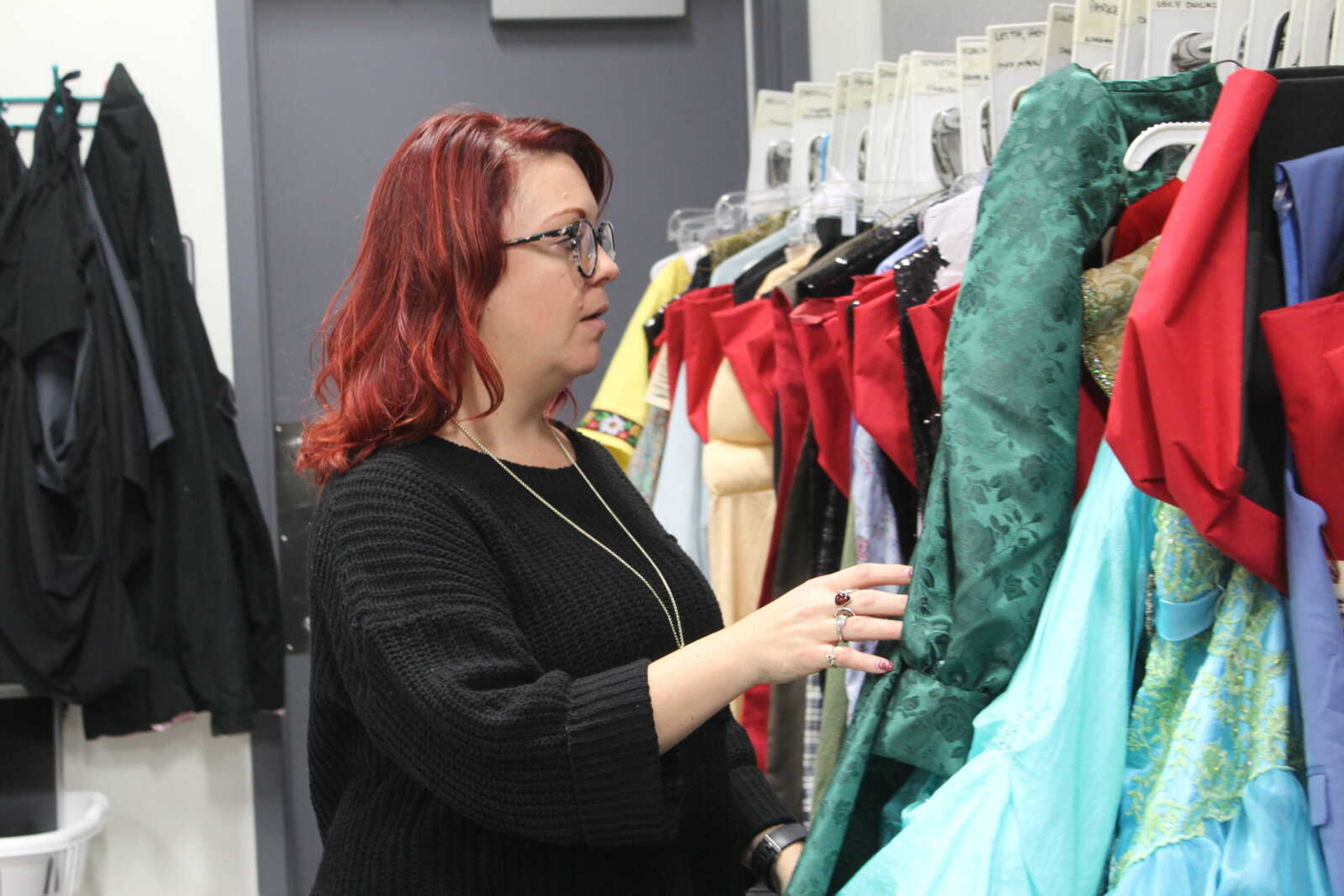 Assistant Professor of Theatre - Costume Designer Amber Cook going through the costumes for "Shrek: the Musical" in the costume shop on River Campus, Jan. 24, 2020.