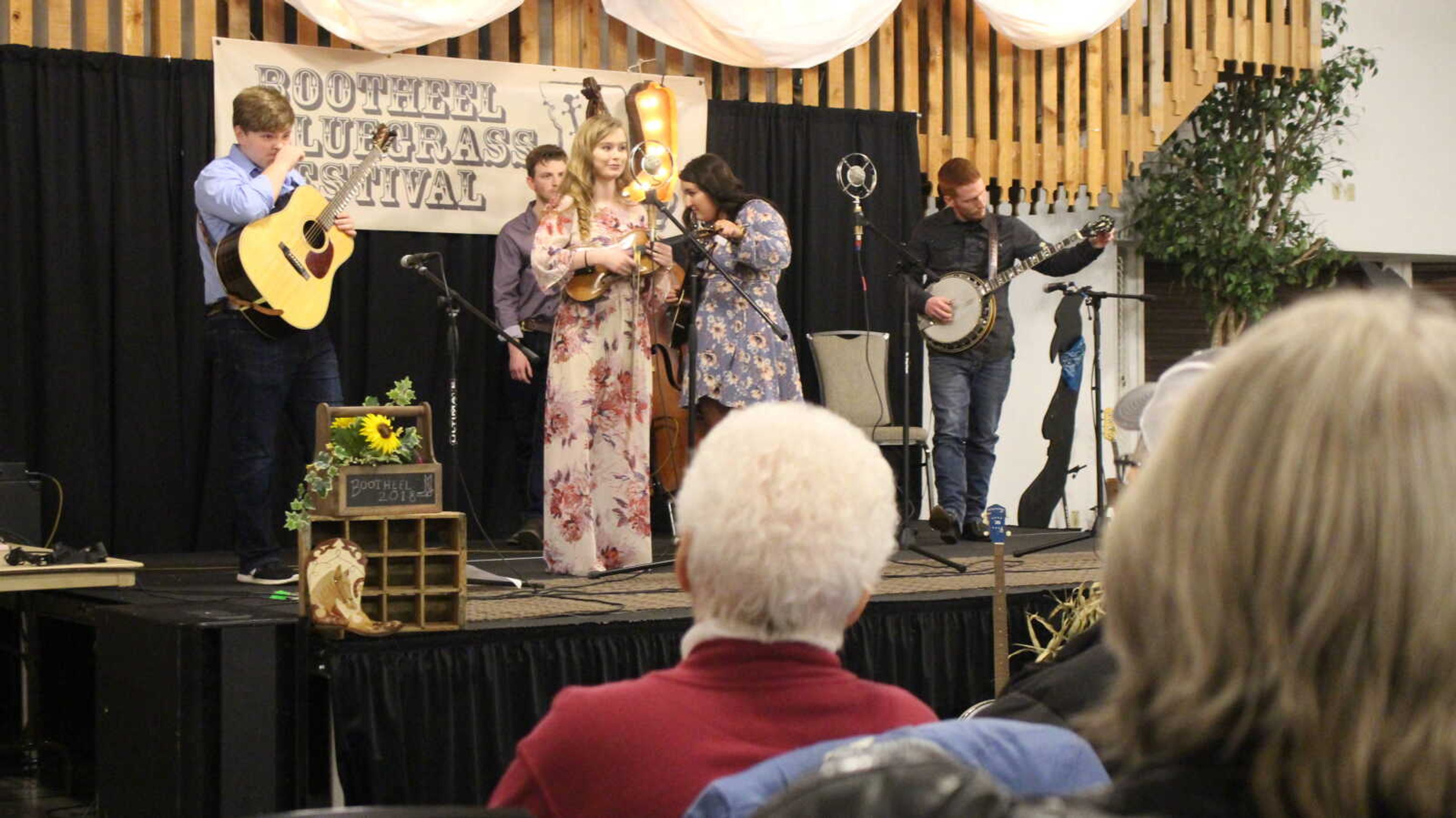 Po' Anna, a five-piece bluegrass band tune their instruments between songs during a performance at the Bootheel Bluegrass Festival at the Bavarian Halle in Jackson Jan. 27.