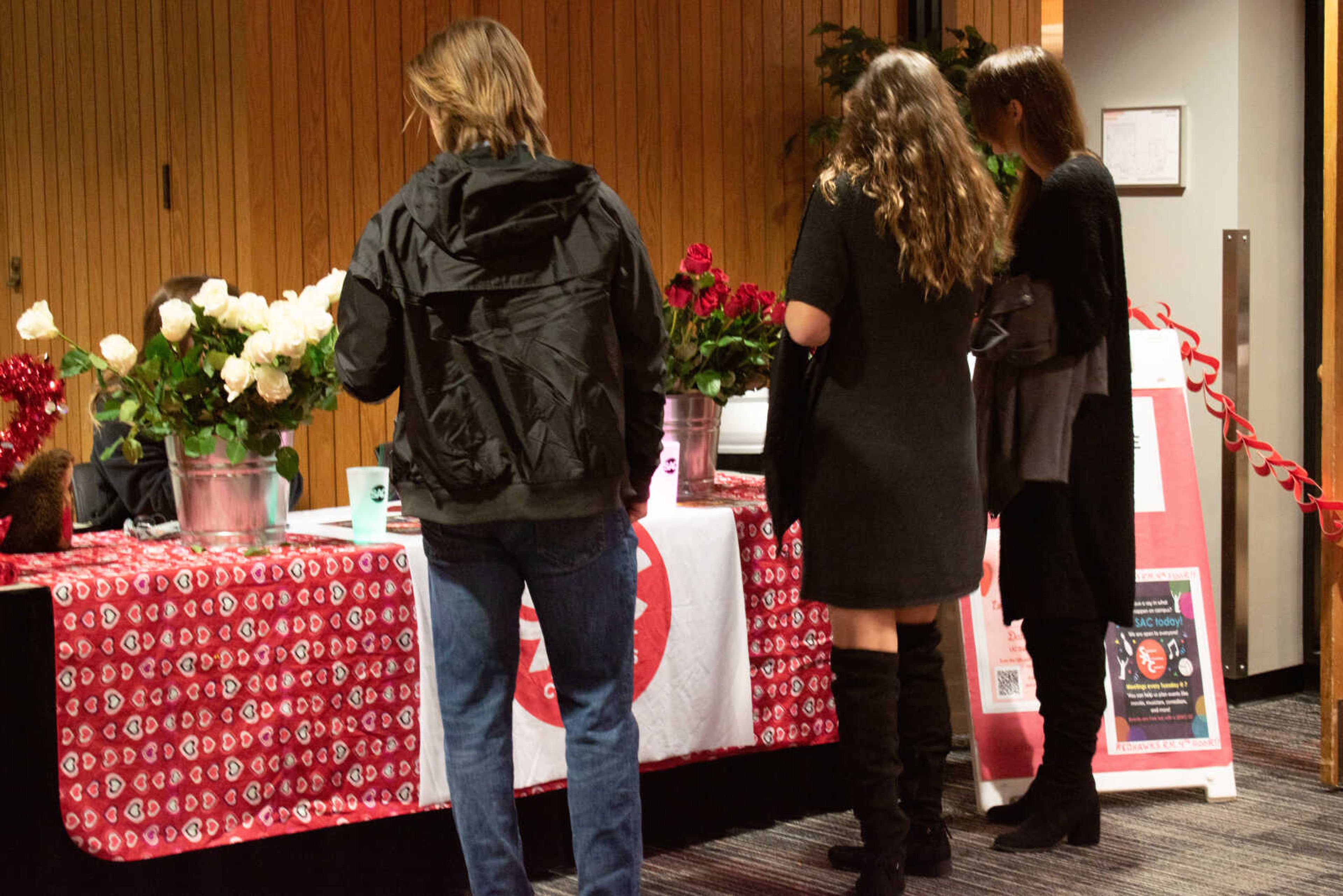 Attendees check in at SAC's "Love Everyone Dance" on Feb. 18. The dance was the last event of SAC's "Love Week."