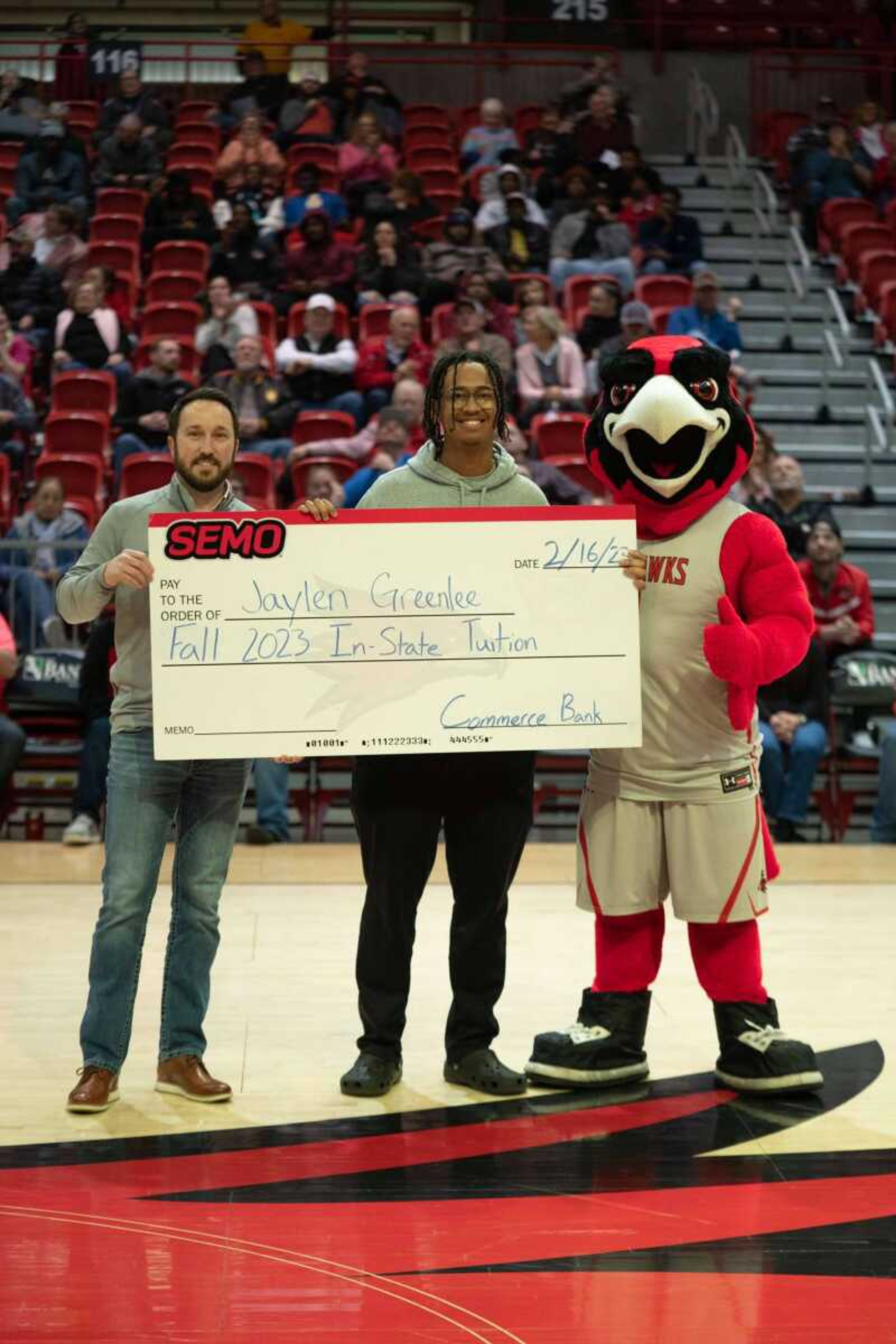 Rowdy and Commerce Bank present 12 credits worth of free tuition to junior biomedical science major Jaylen Greenlee. Students received tickets to enter the tuition raffle if they arrived before halftime of the men’s basketball game on Feb. 16.
