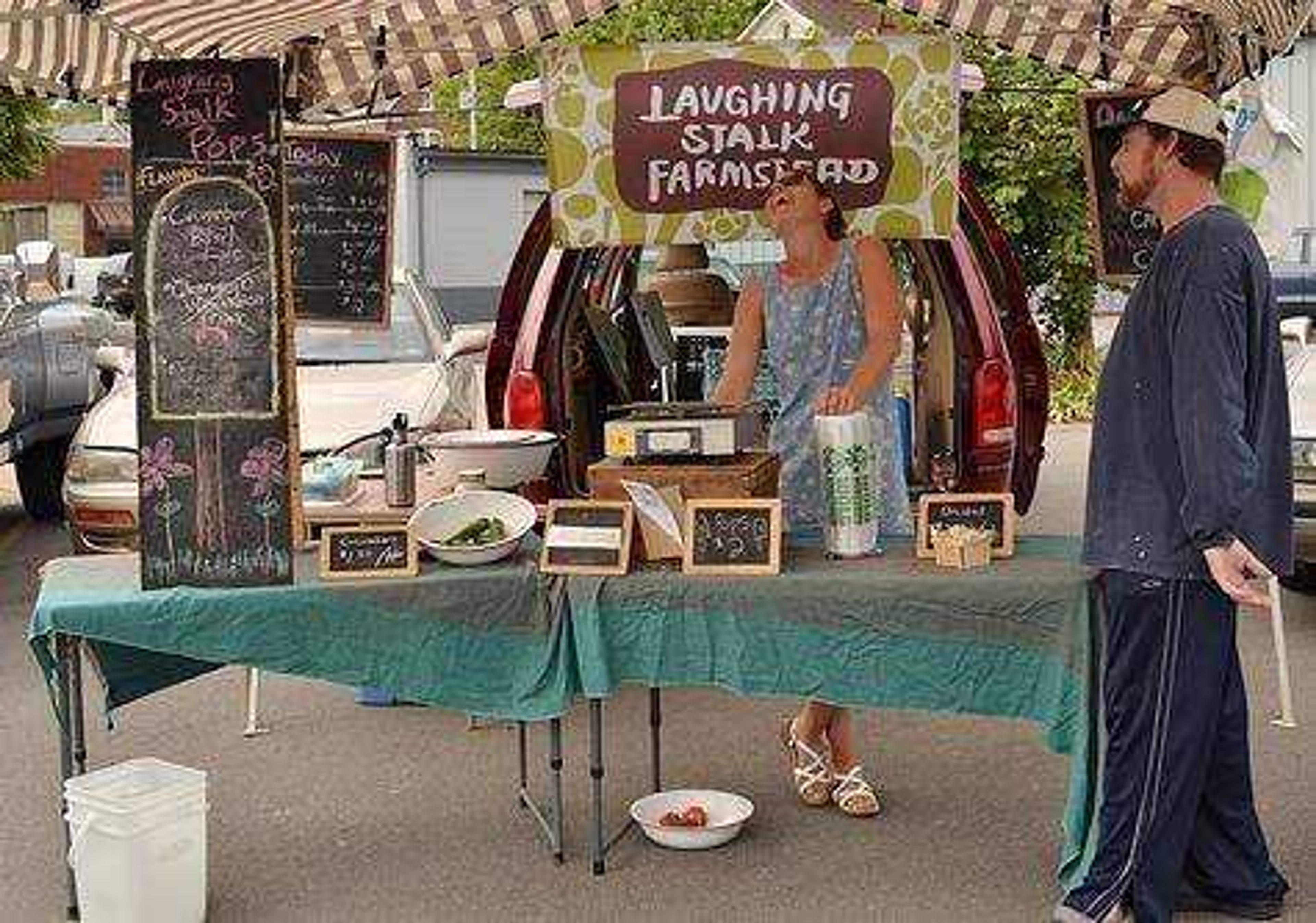 Emily Scifers, owner of Laughing Stalk Farmstead, at her booth at the Cape Riverfront Market. Photo by Amber Hawkins