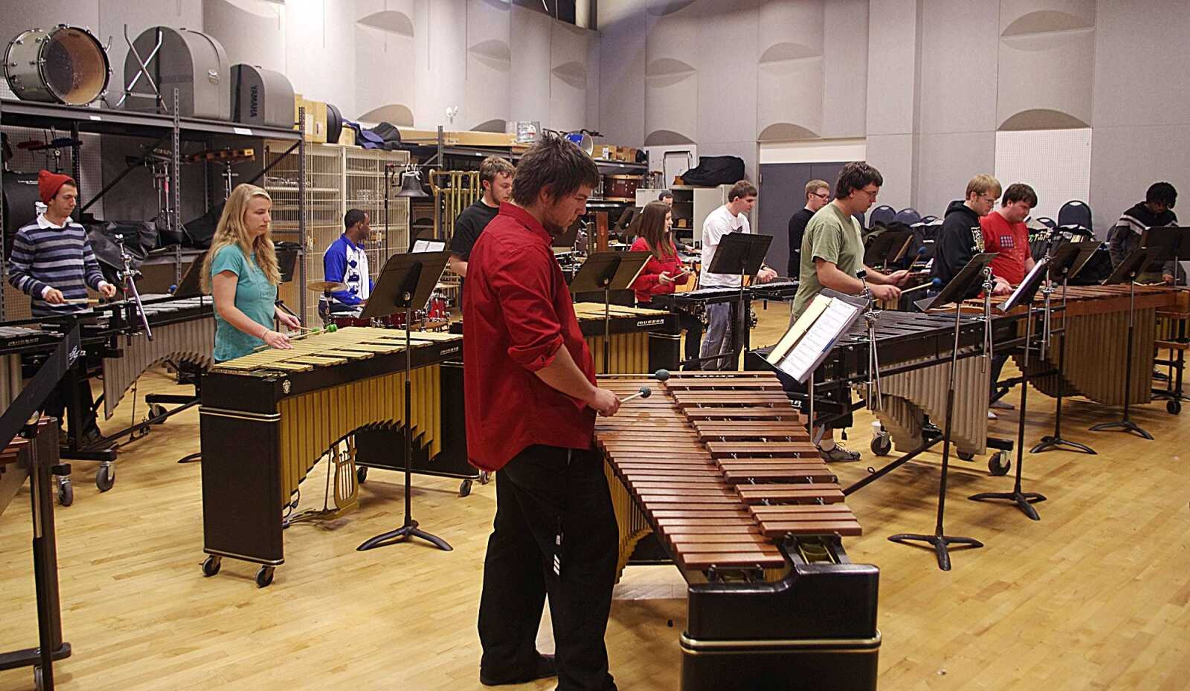 Members of the percussion ensemble rehearse for the Family Holiday Concert at the River Campus Nov. 28. Photo by Nathan Hamilton