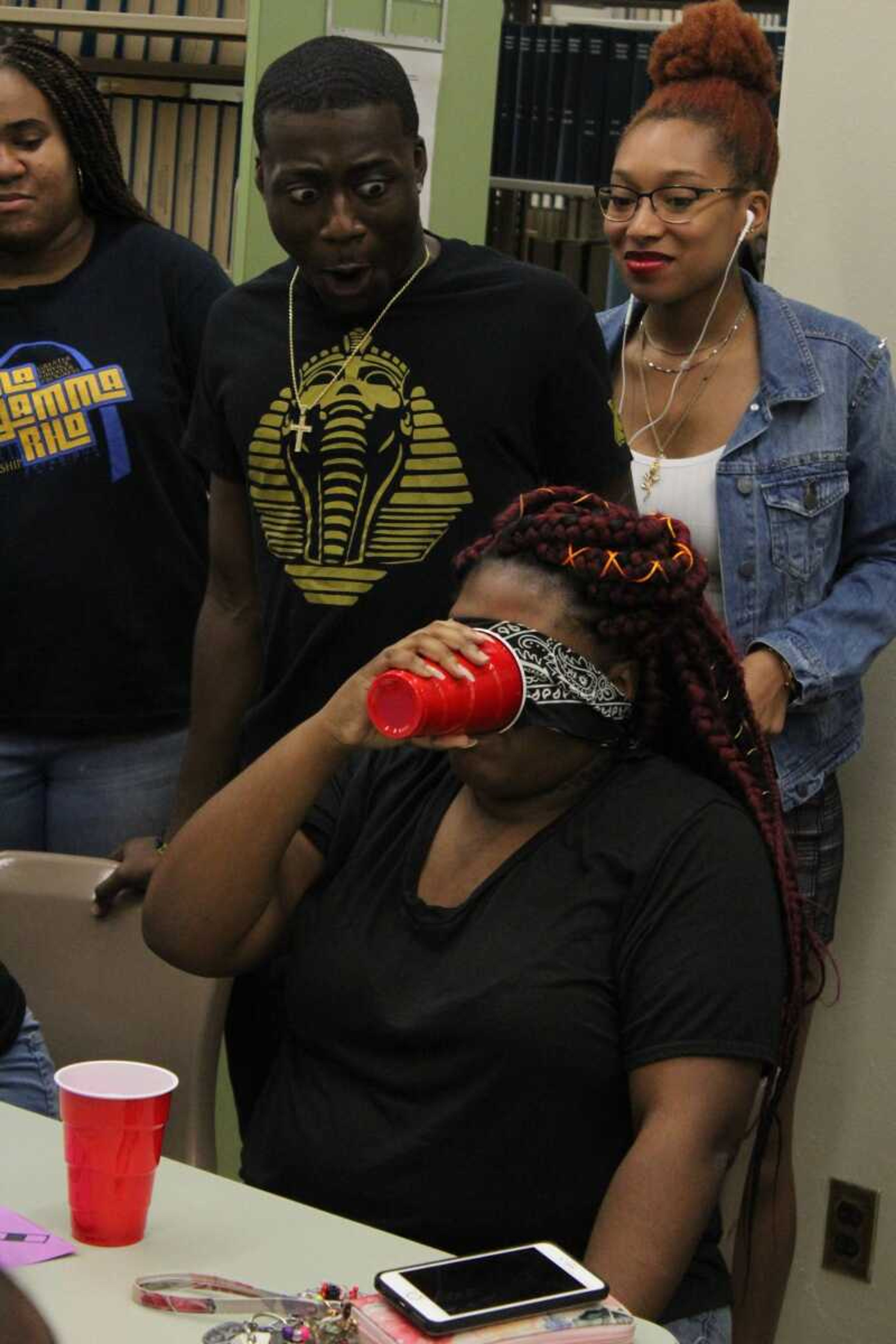 Member of National Pan-Hellenic Council completes challenge by drinking tomato juice blindfolded on Oct. 8