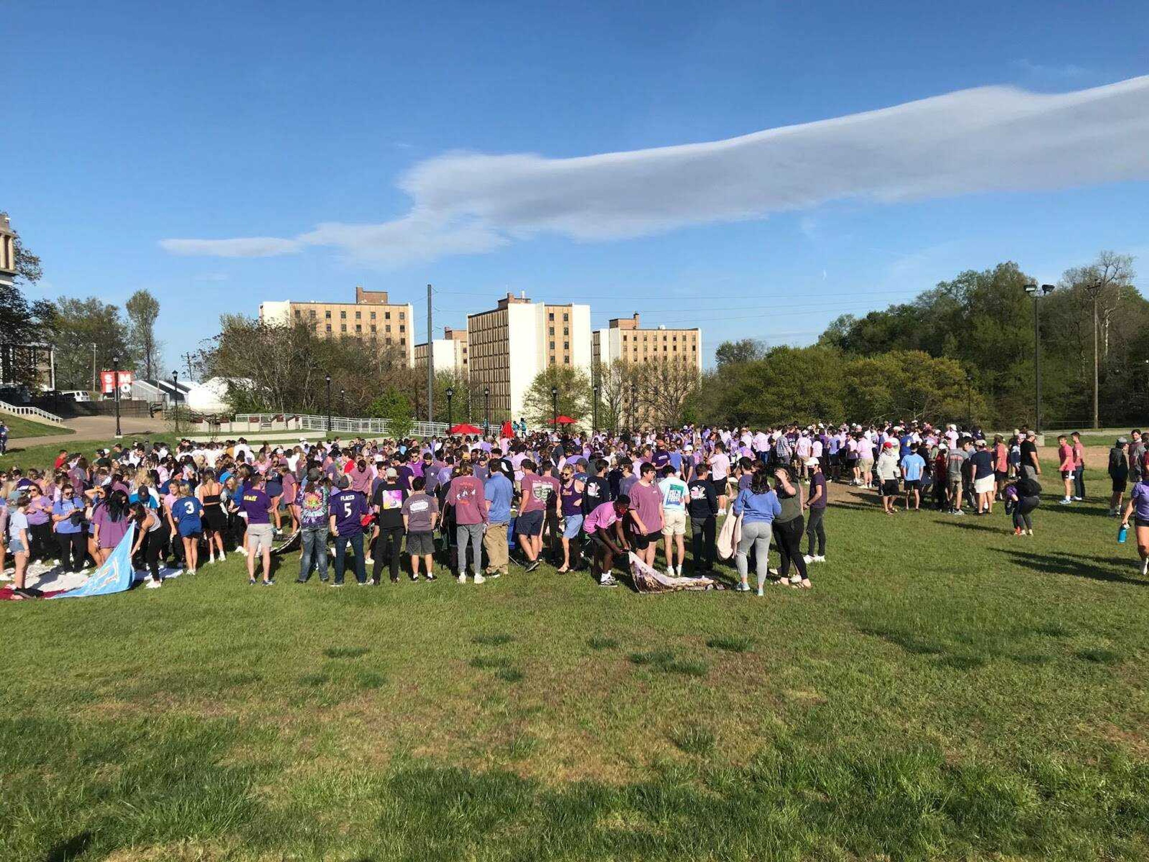 Students gather at Parker Field following the Walk A Mile Event on April 14. The event is a chance for students who have faced or oppose sexual assault to walk with one another and share their experiences.