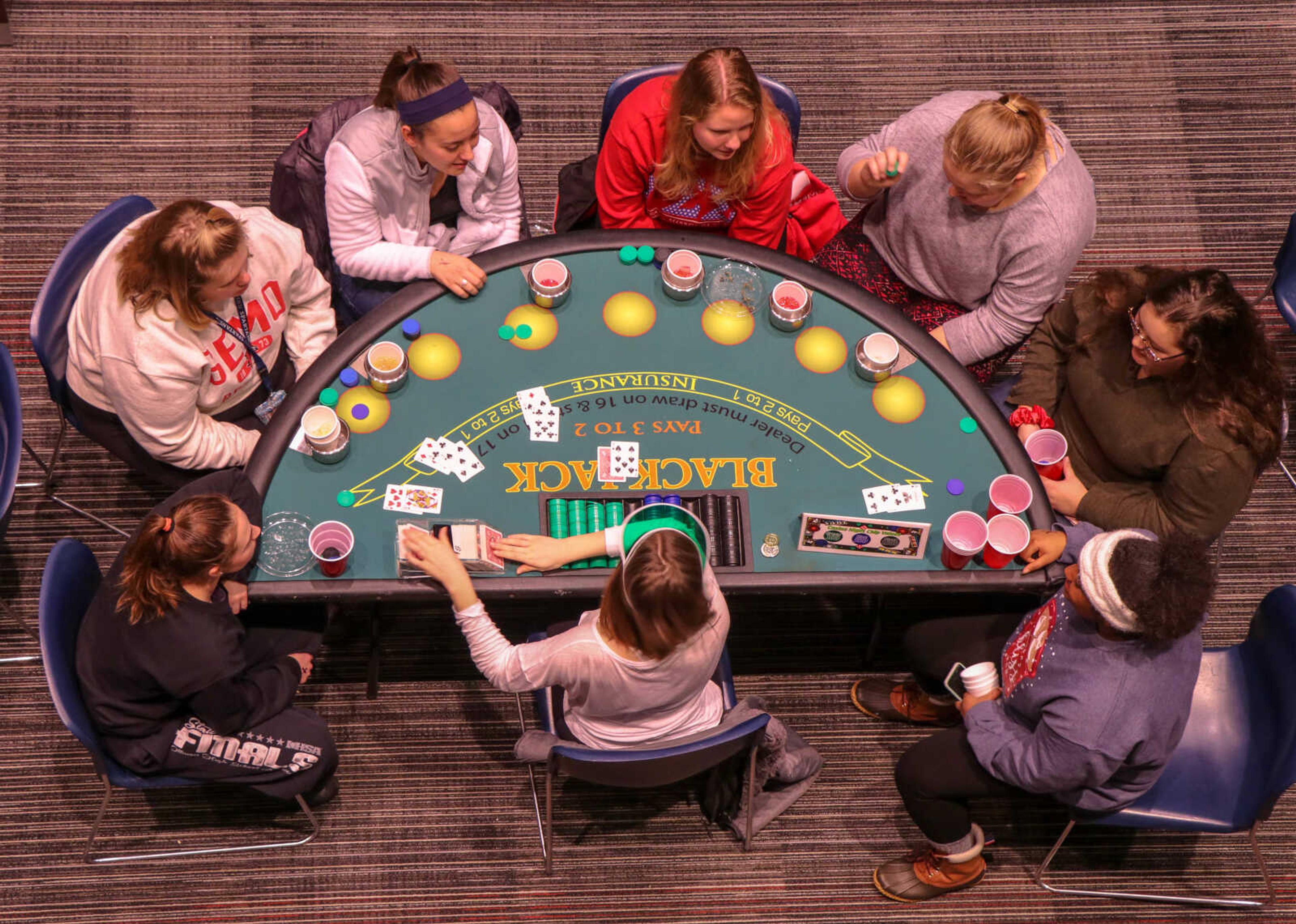 Southeast students gather around Blackjack table during the Casino Night on Jan. 19.