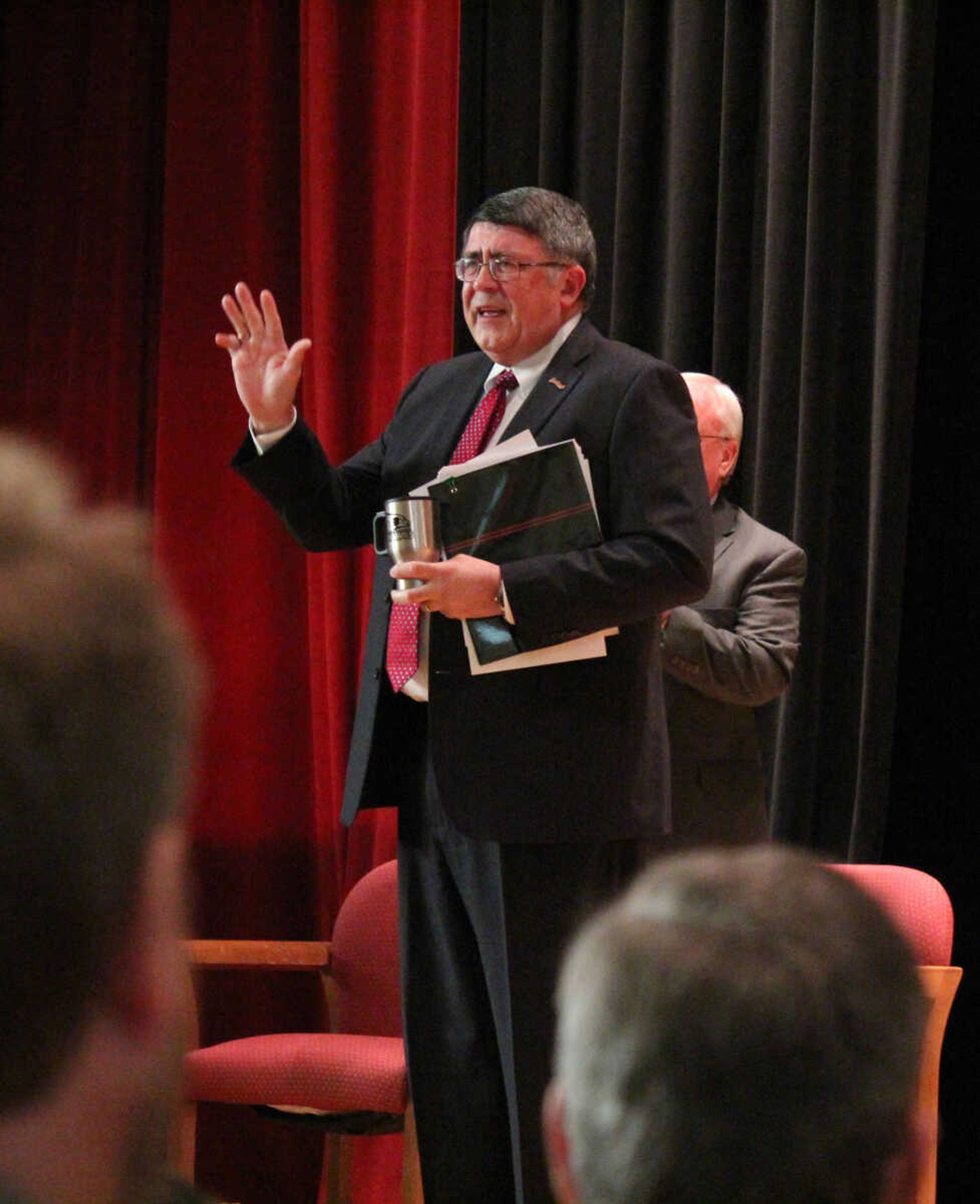 An emotional Southeast Missouri State University President Dr. Kenneth W. Dobbins waves to the crowd after he announced his retirement during the State of the University address on Monday in Academic Hall. (Photo by Sean Burke)