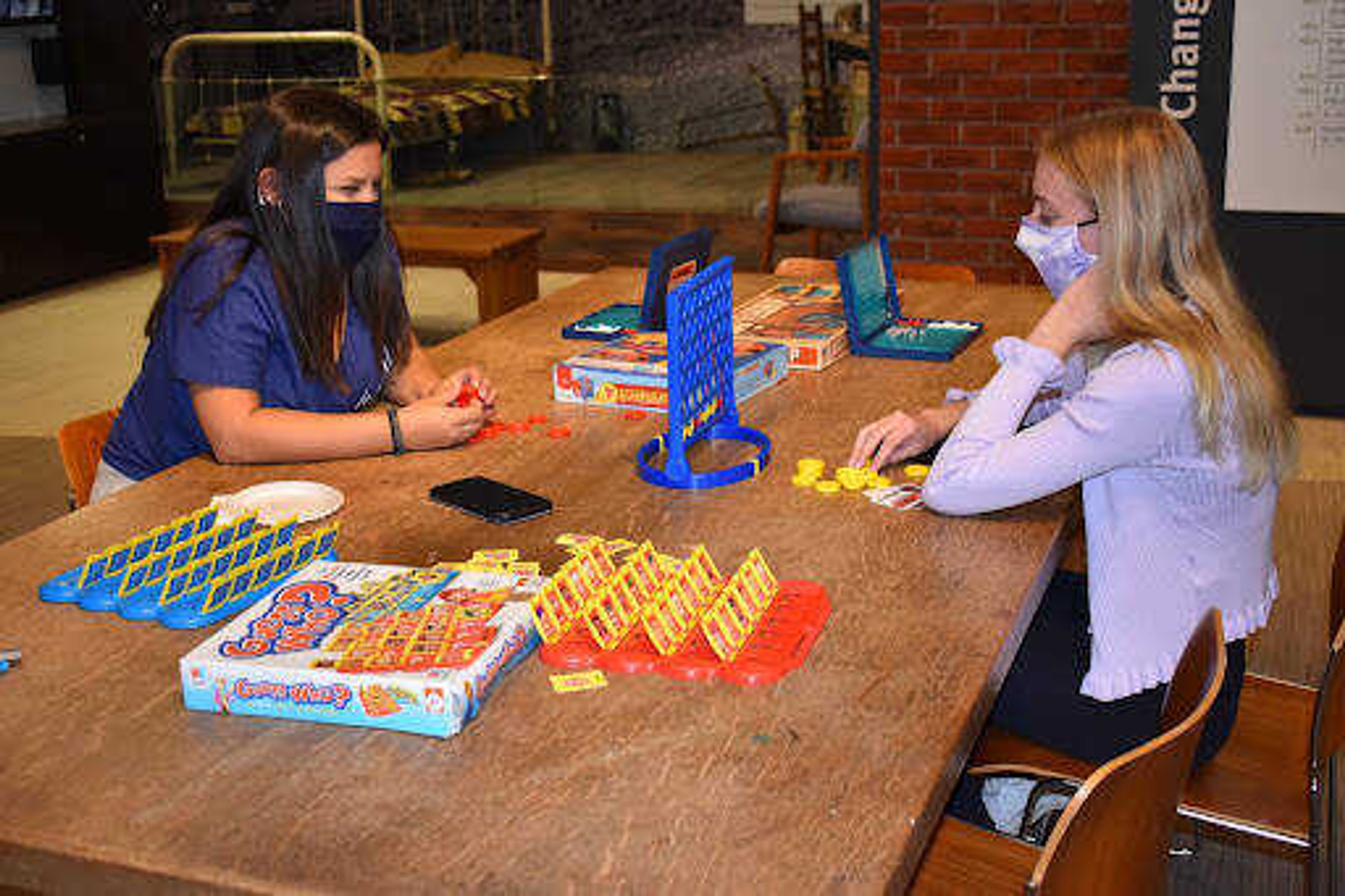 Freshman Musical Theater majors Jessica Farfan (left) and Megan Hoffman (right) playing Connect Four at Crisp Museum's Game Night. Participants could also play Monopoly, Sorry, Risk, Jenga, Dominoes, Battleship and Guess Who.
