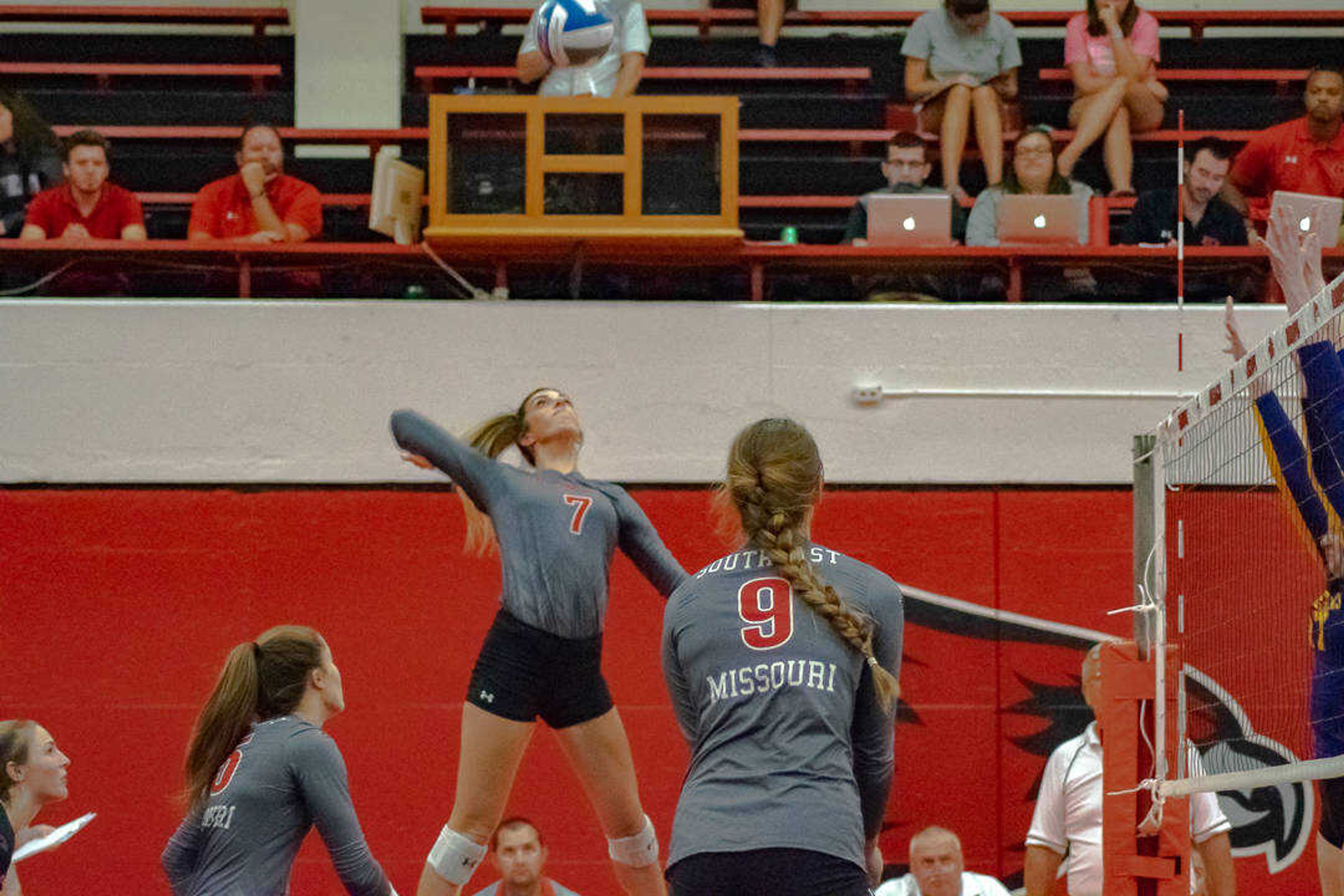 Junior outside hitter Laney Malloy (middle) rises up for a spike in a match against Western Illinois on Sept. 6 at Houck Field House.